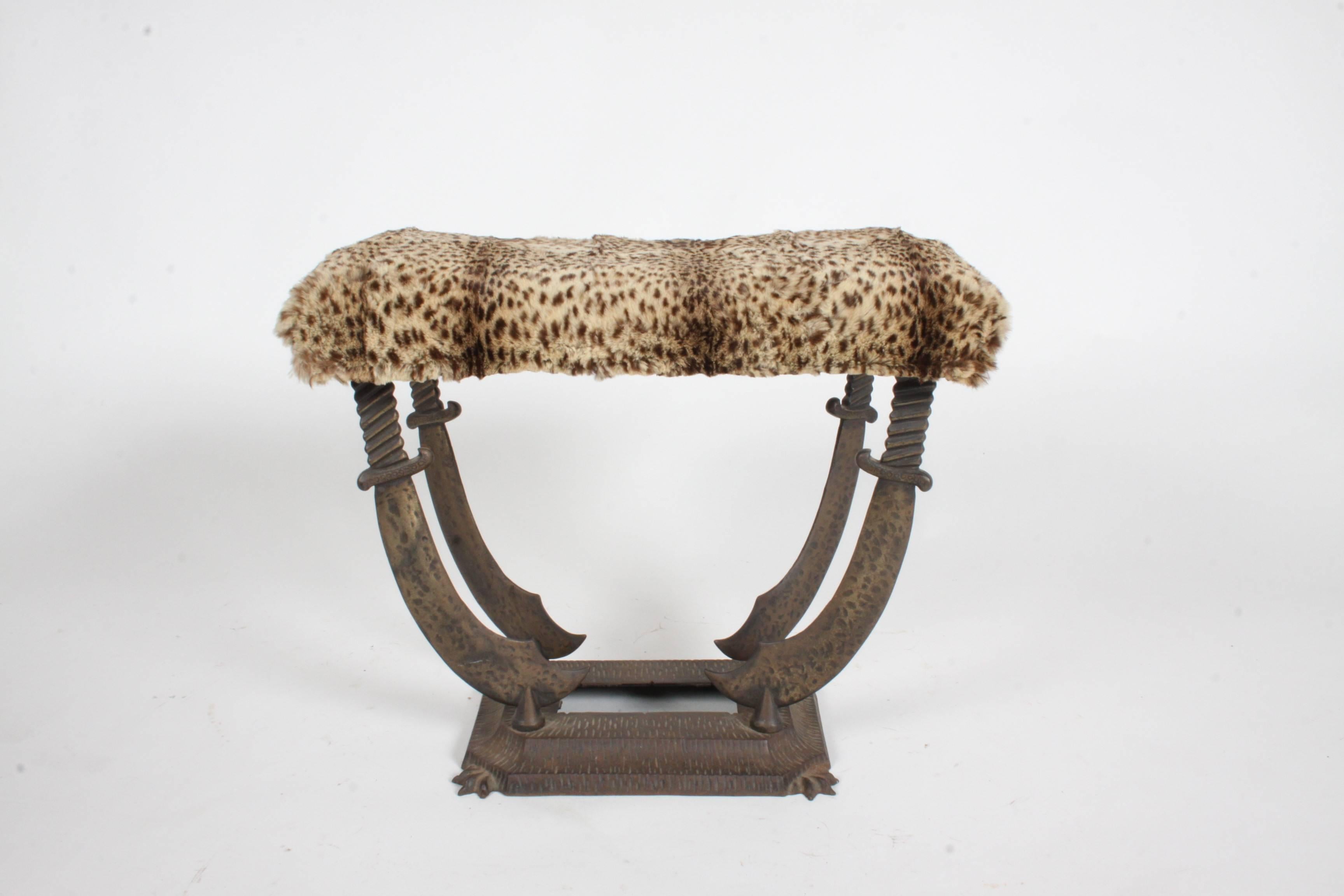 Art Deco sabre cast iron bench or stool with vintage leopard upholstery. Stamped Verona, with pat. number. In the style of Oscar Bach. Vintage leopard fur, bench purchased form long time Art Deco dealer and collector.