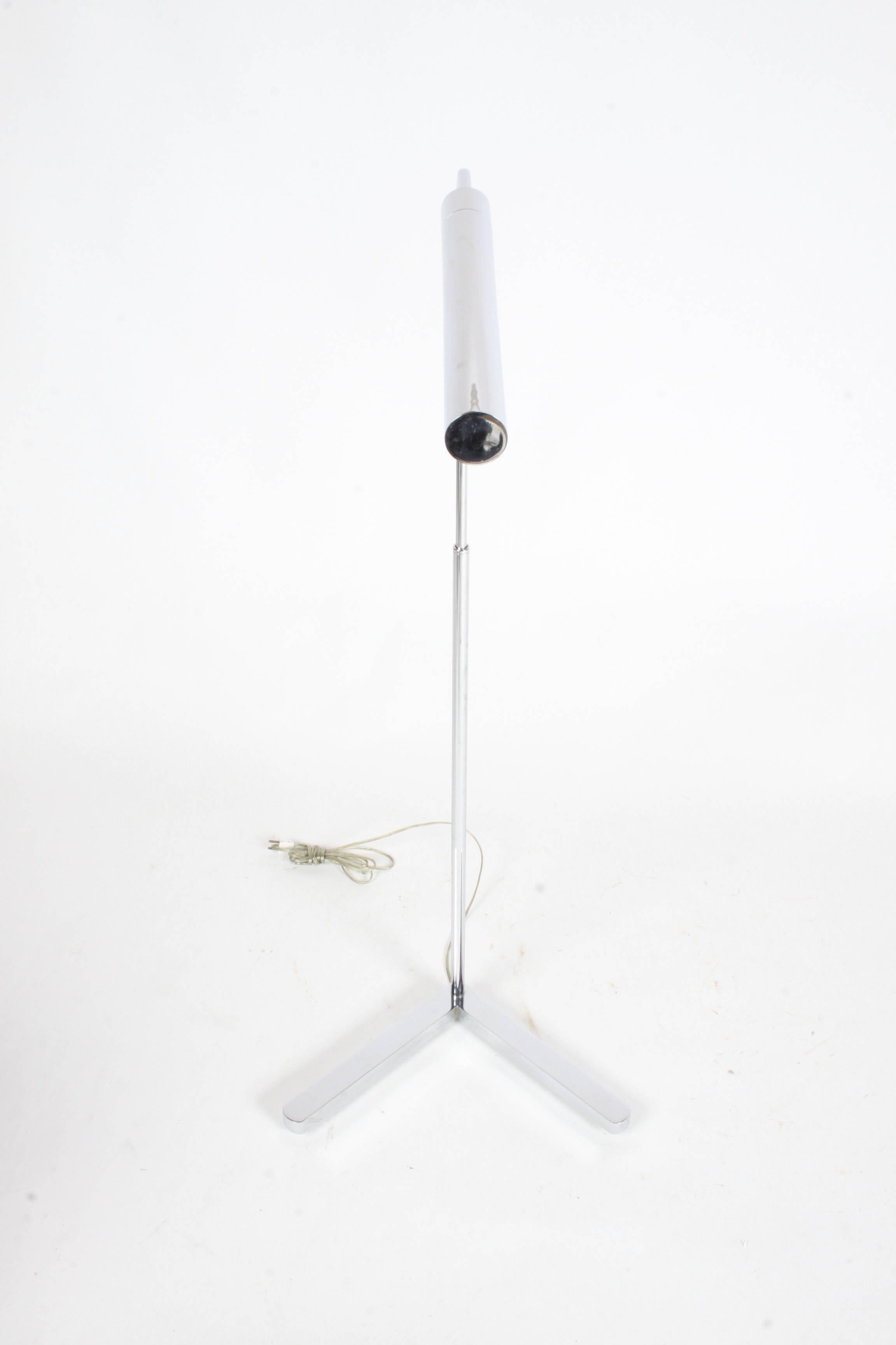 Casella adjustable chrome floor reading lamp, take short of long cylindrical bulbs. In the style of Cedric Hartman. Adjusts from 38.5