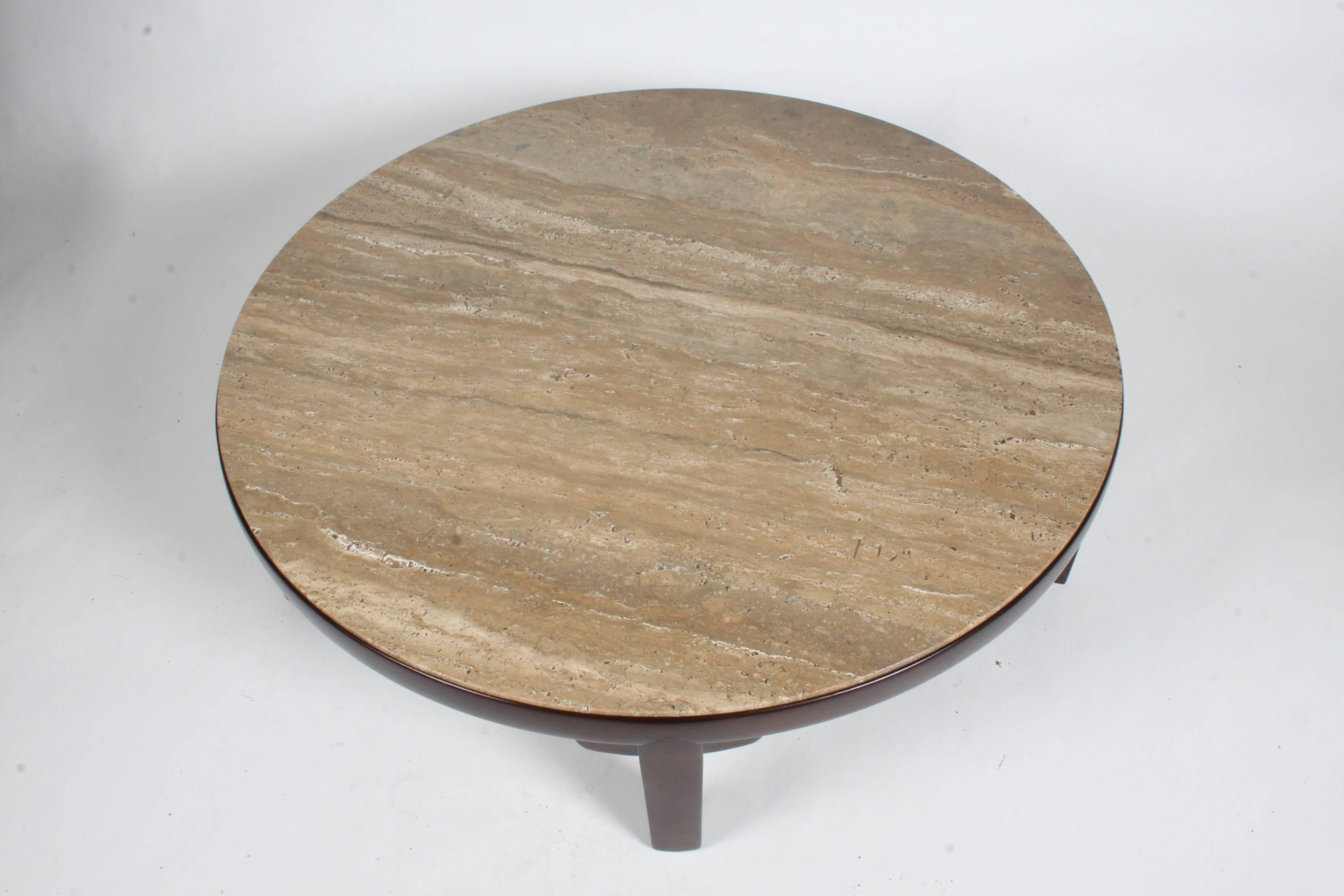 Beautiful large Edward Wormley for Dunbar Asian influenced round coffee table. Original walnut Roman travertine top that is marked made in Italy. Mahogany base has been refinished to match the original color. Marked with brass Dunbar tag. Excellent