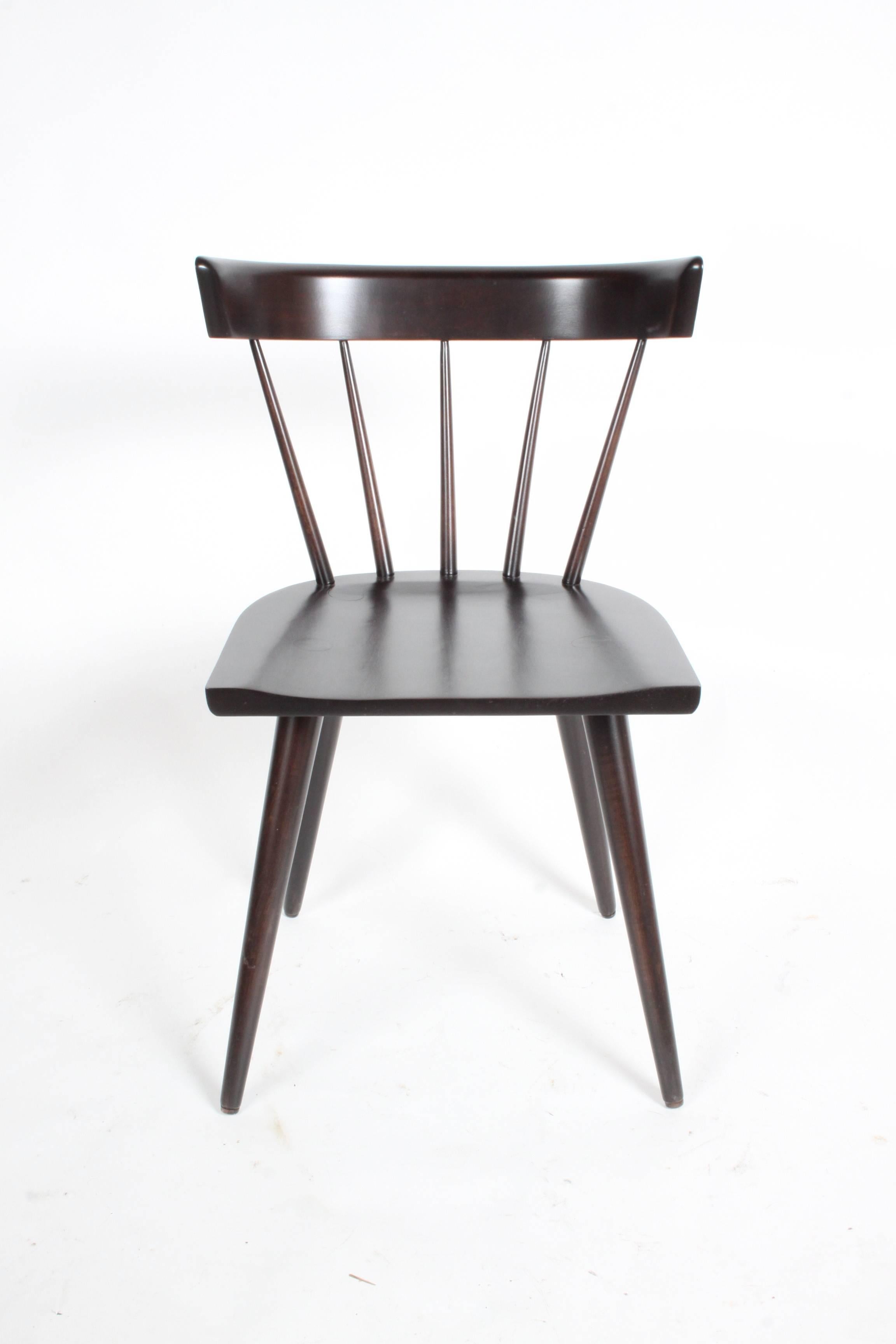 Set of four Paul McCobb for Planner Group dining chairs refinished in dark espresso finish, some chairs have labels.