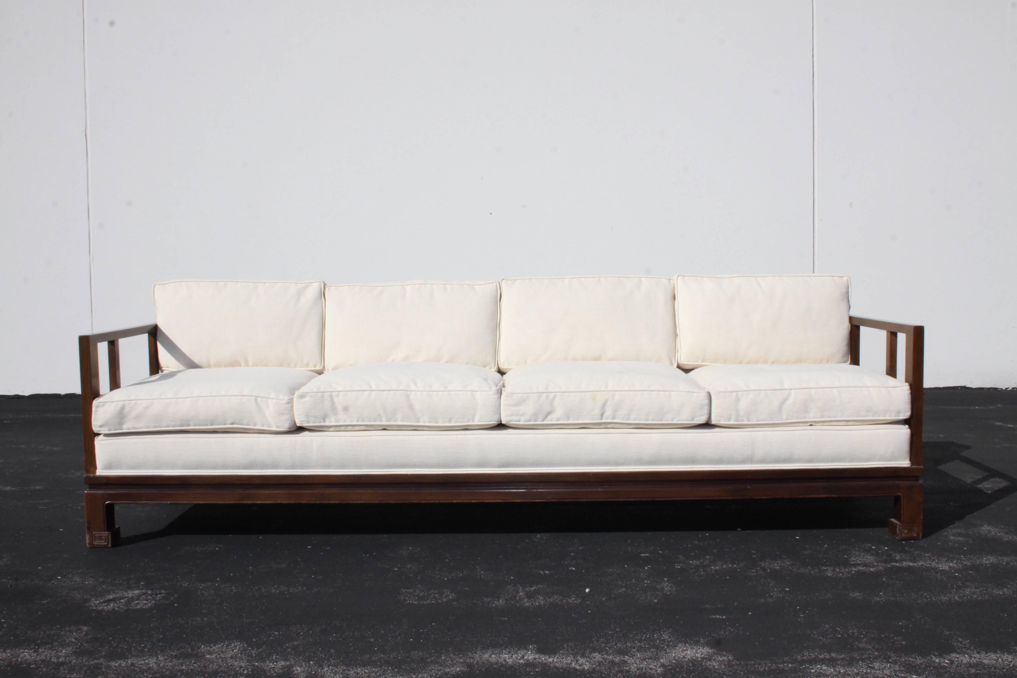 Michael Taylor designed sofa for the Baker Far East collection with down filled cushions. This sofa has been reupholstered at some point, has a few stains, as seen in photos, I would suggest re-upholstery if perfection is desired. I can proved a