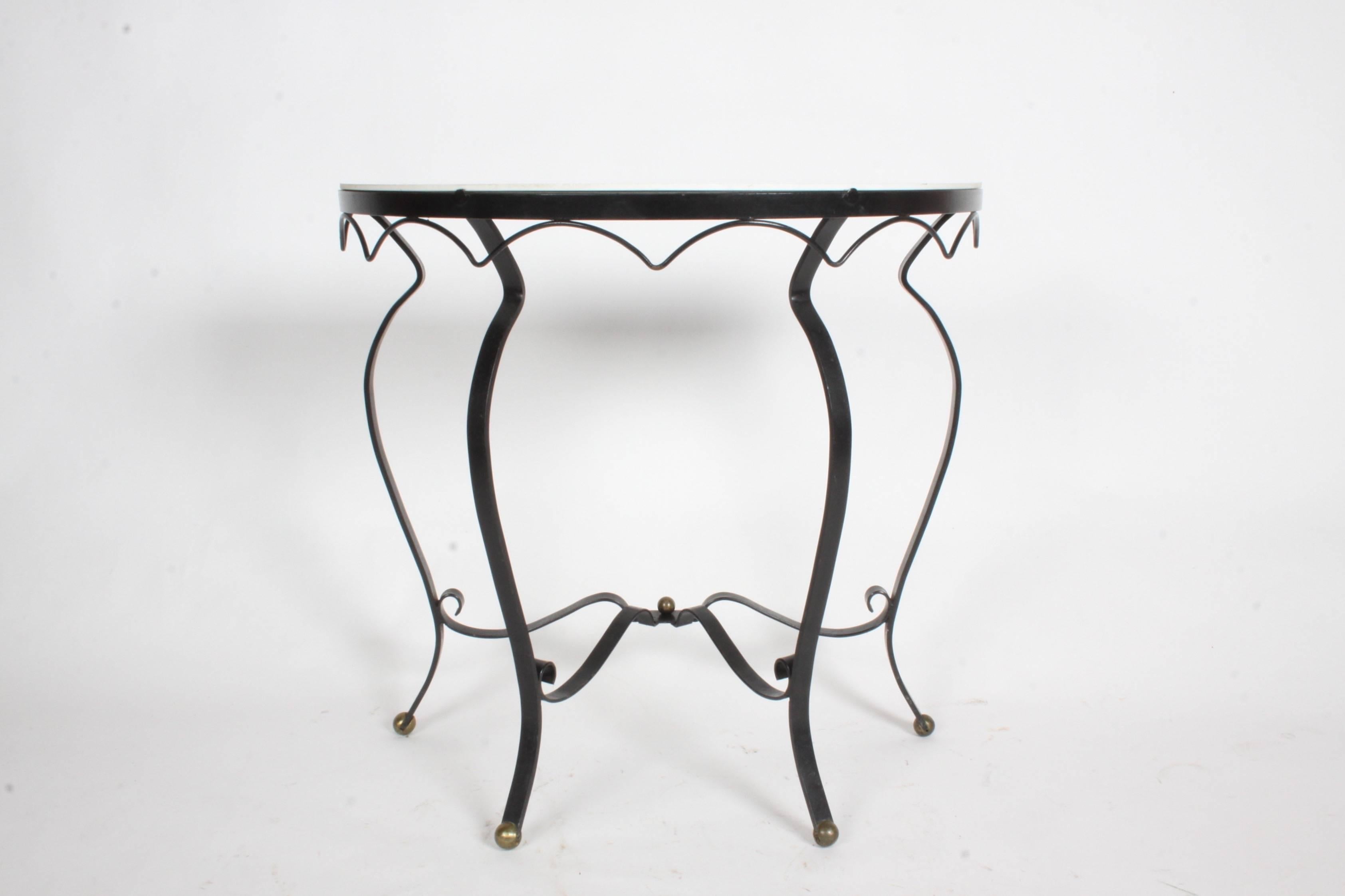 French Deco style wrought iron and vitrolite demilune console 1940s with brass ball details. Some loss of paint. No chips to vitrolite. Mid-Century Modern.