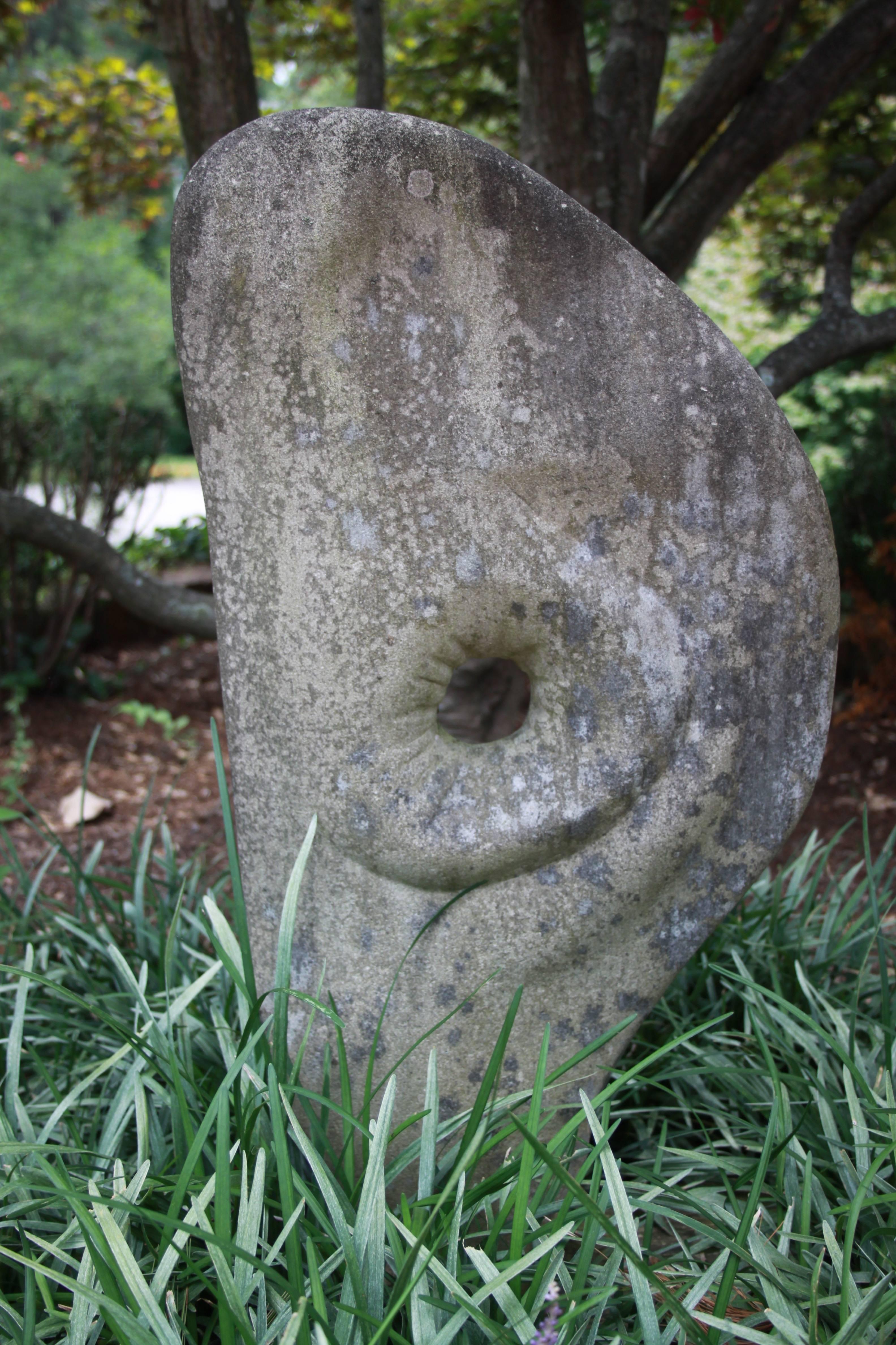In the style of Barbara Hepworth organic form hand-carved stone sculpture with beautiful natural patina. This sculpture also resembles the style of Isamu Noguchi. Purchased 15 years ago from a local art collectors mid century estate. 
More photos