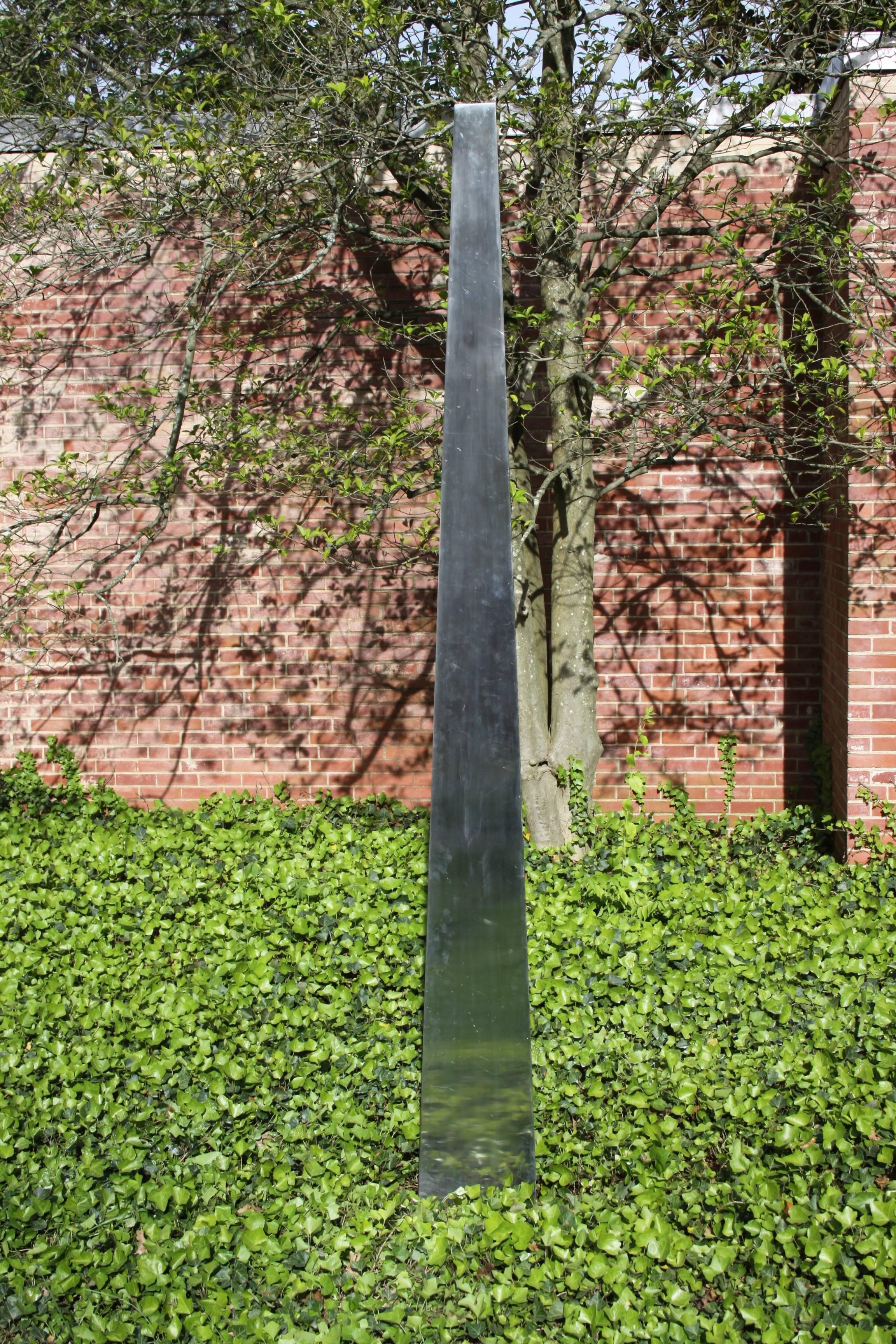 Large stainless steel triangular obelisk sculpture for the garden, courtyard or yard. This sculpture comes from a local estate of an owner of a local bank. I believe this was commissioned in the 1970s or early 80s for his yard, it is very well made!