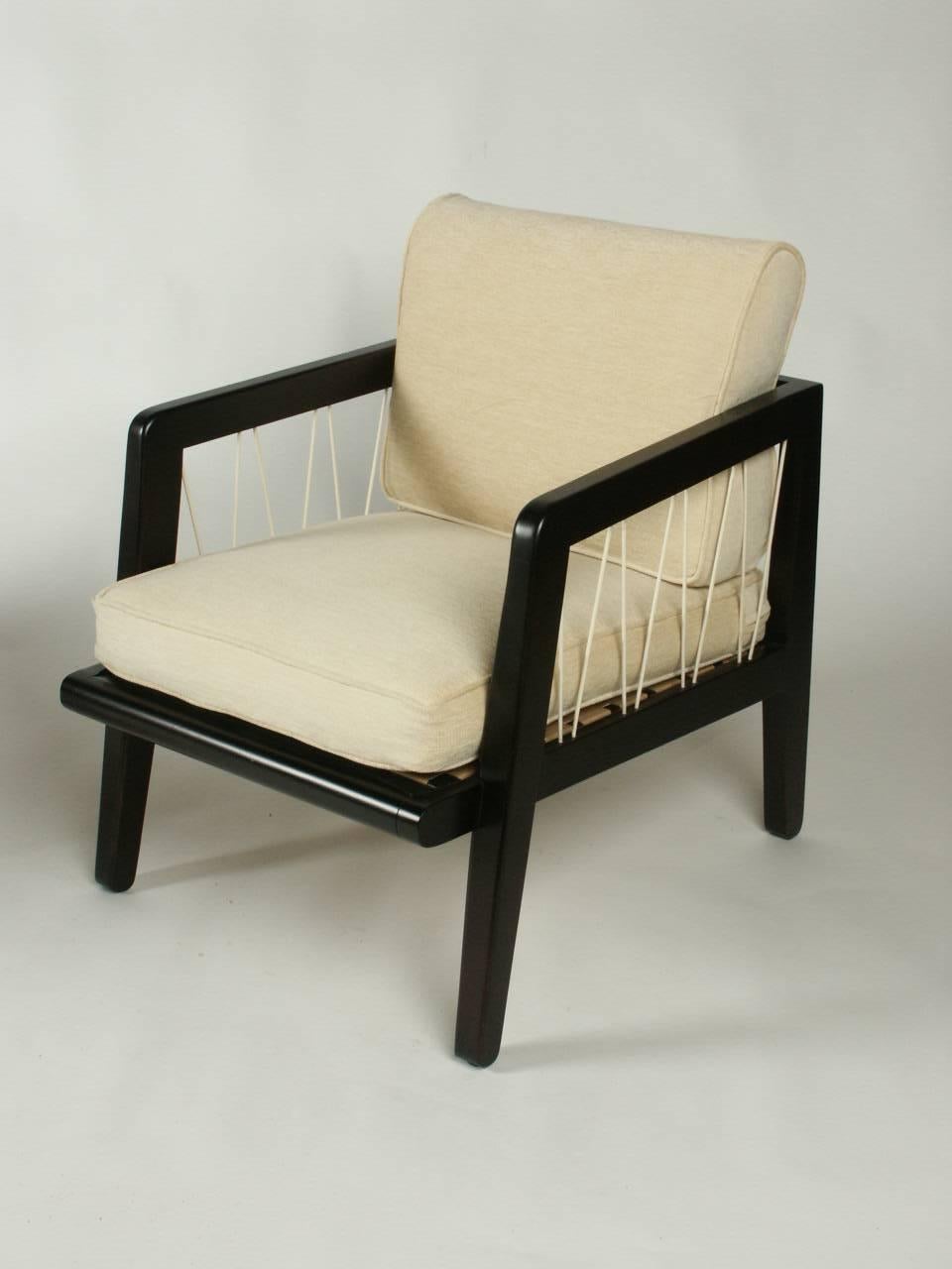 Pair of Edward Wormley Precedent collection for Drexel lounge chairs, circa 1947, dark stain on silver elm with woven nylon cording that zig zags between frame arm and seat. COM as this set shown is sold. This line was designed while designing for