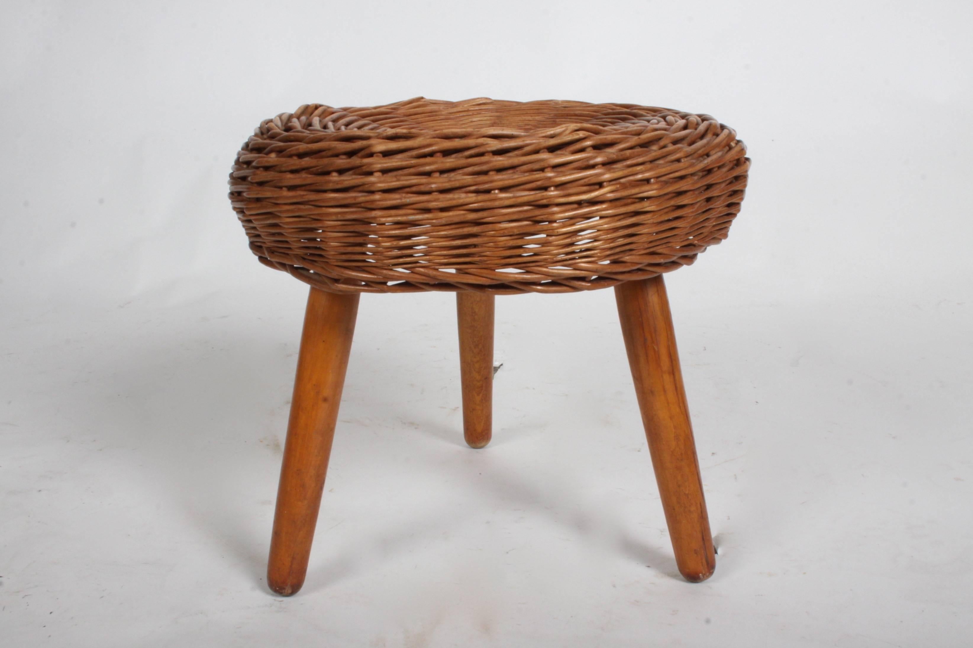 Tony Paul rattan stool on wood legs, circa 1950s.