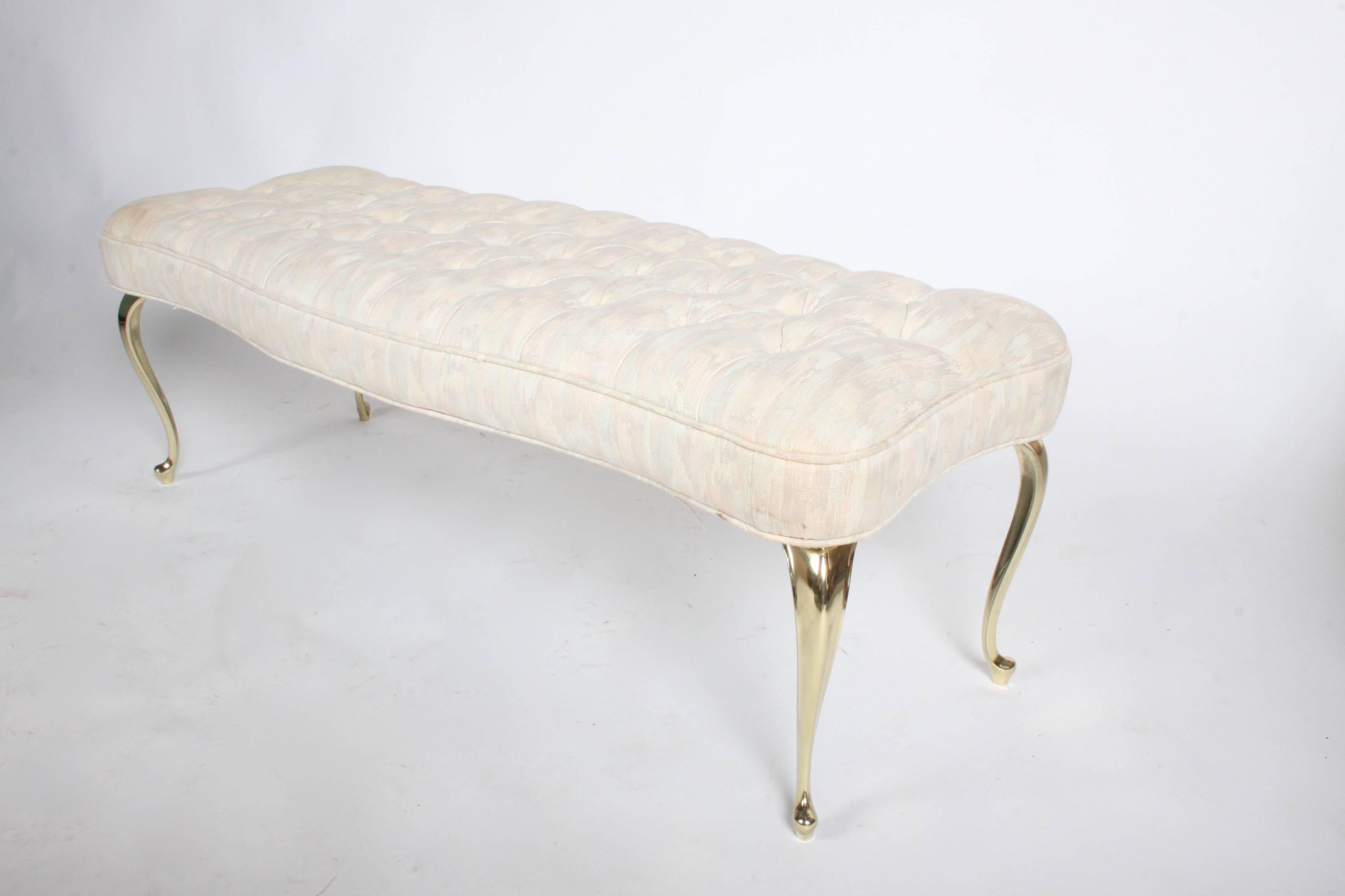 Hollywood Regency tufted bench with nice neoclassical style brass plated legs. Legs have been polished and re-plated in a warm butler brass finish. Upholstery is in need of updating. This makes a great end of the bed bench, circa 1950s.