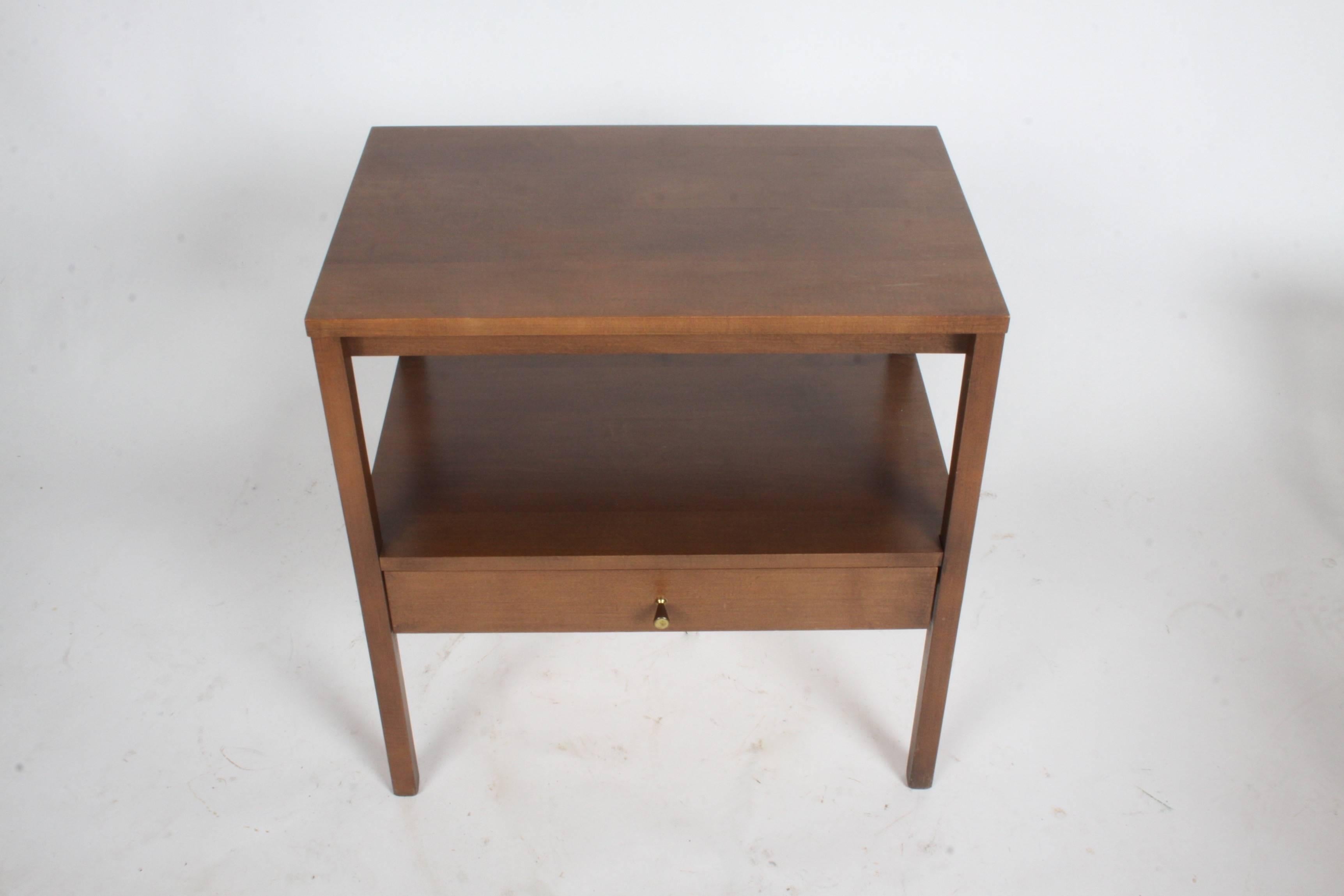 Paul McCobb single end table or nightstand for Planner Group with original finish. Labelled, brass cone pull. Overall very nice original finish. Can be refinished in a darker color for additional cost.
