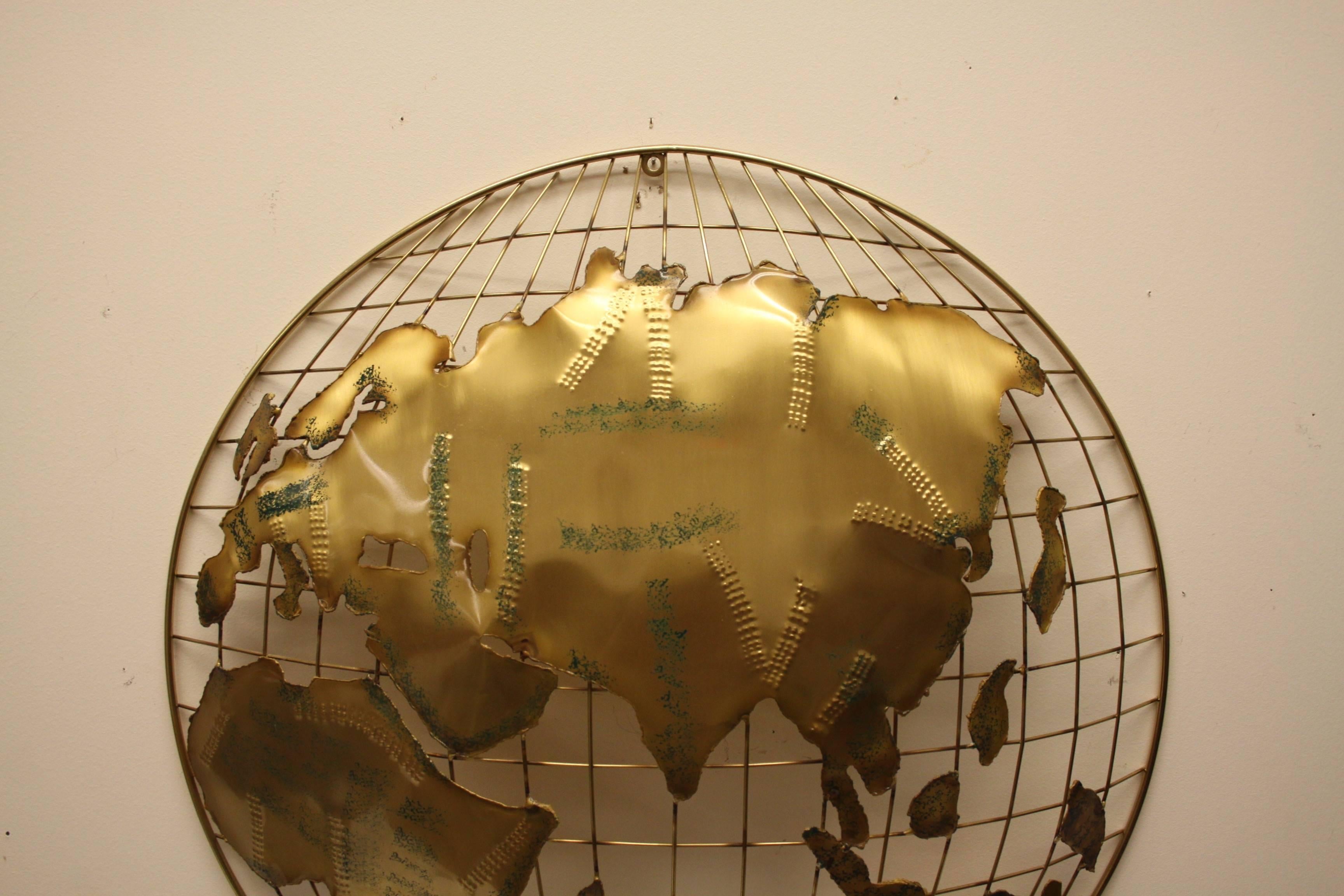 Curtis Jere brass globe sphere sculptures signed and dated 1984. Torched cut shapes with textured brass metal to create mountains , applied green paint and clear lacquer. Each sculpture is handmade, originally designed in the 1960s, this production