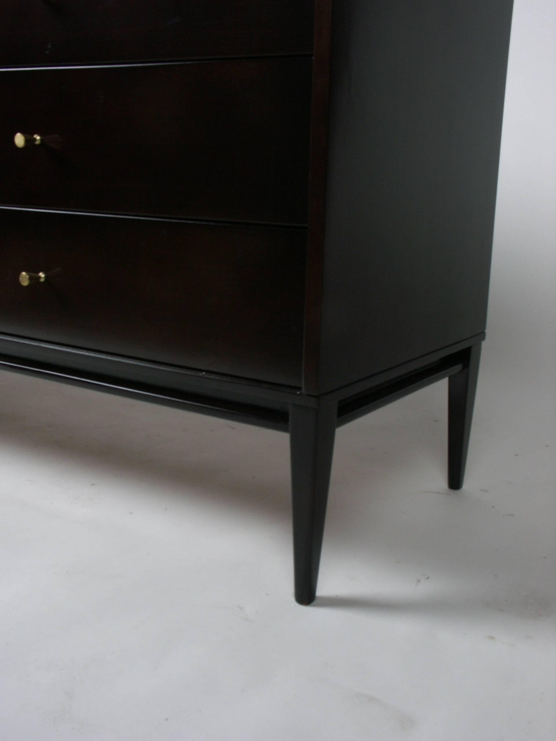Paul McCobb for Winchendon Planner Group, eight-drawer chest with polished conical brass pulls and elegant tapered legs, finished in beautiful dark espresso on birch, circa 1950s. Currently being refinished, custom stain available.