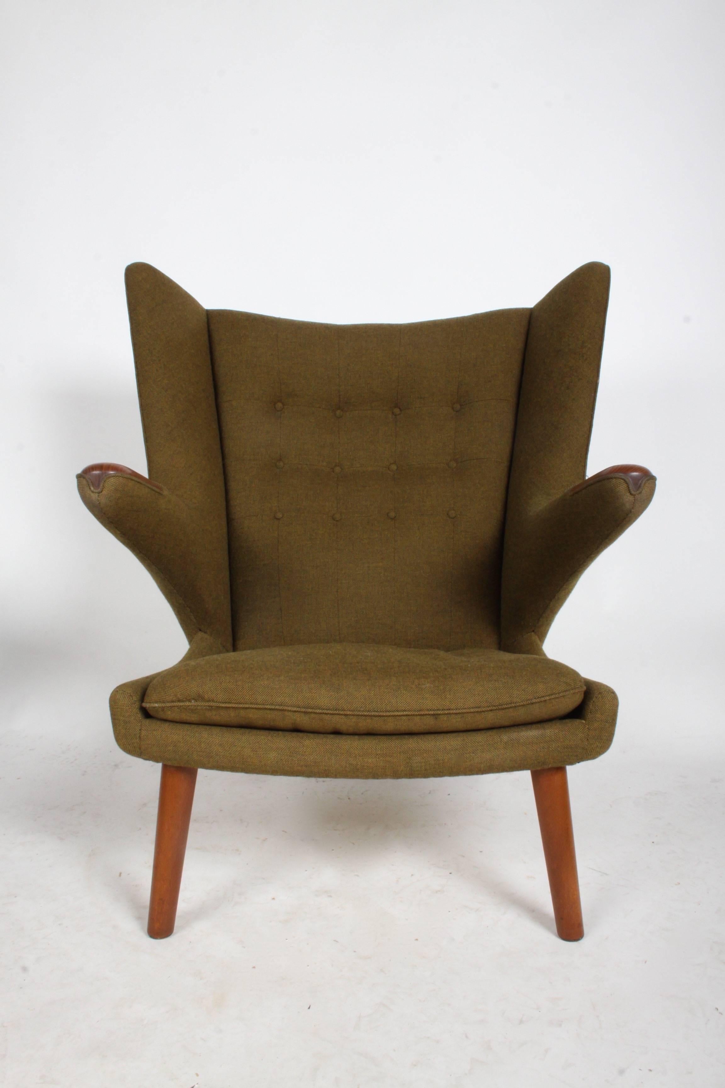 Completely original Hans J. Wegner Papa Bear easy chair by AP Stolen, Denmark. Retains original dark wool upholstery and straps, both in excellent condition! Doesn't need to be reupholstered, unless you want to update upholstery. Even has the