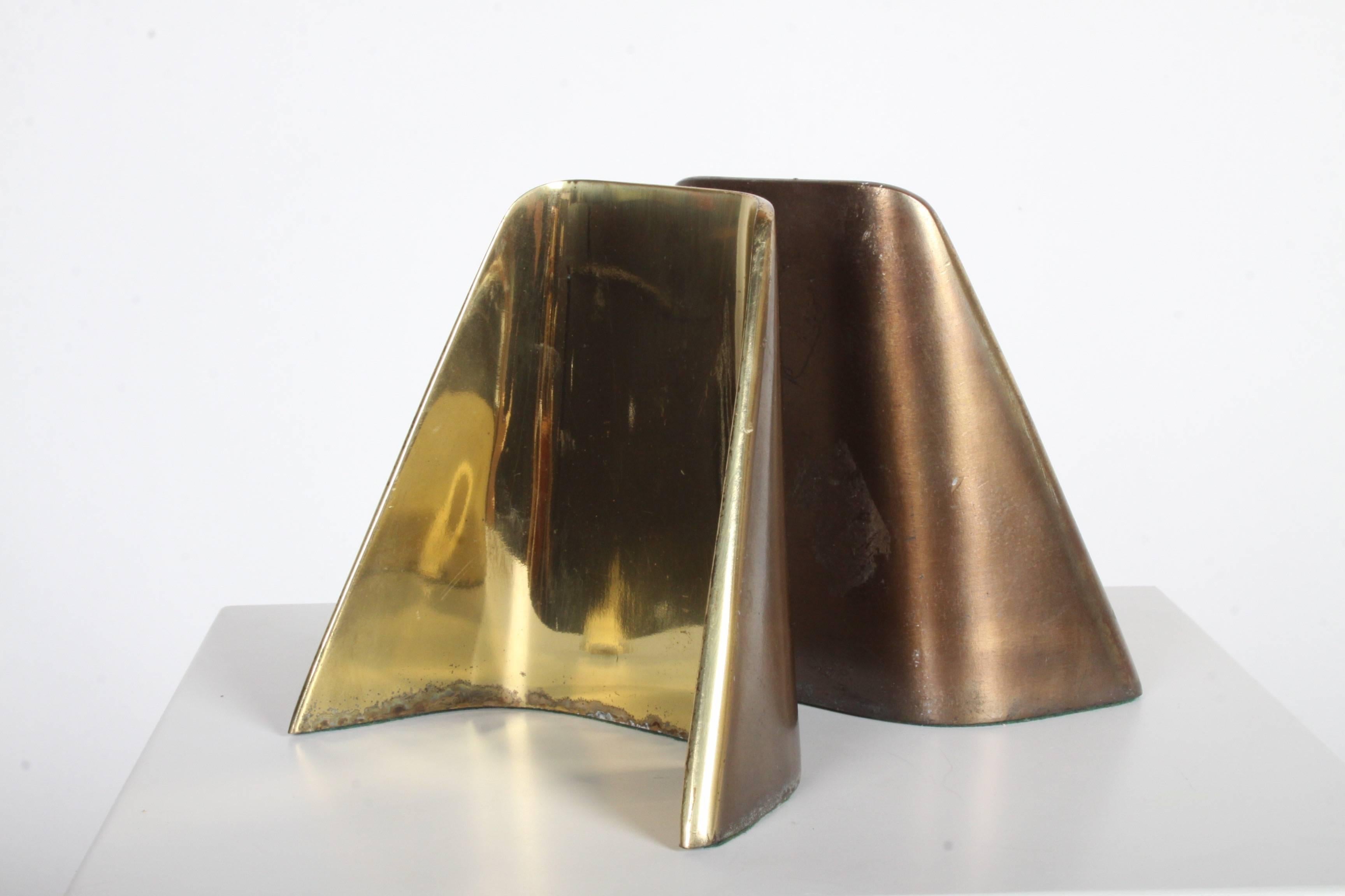 Ben Seibel bookends in Shovel form in brass finish, designed for Jenfred-Ware and marketed for Raymor. Nice vintage condition, some discoloration to brass.