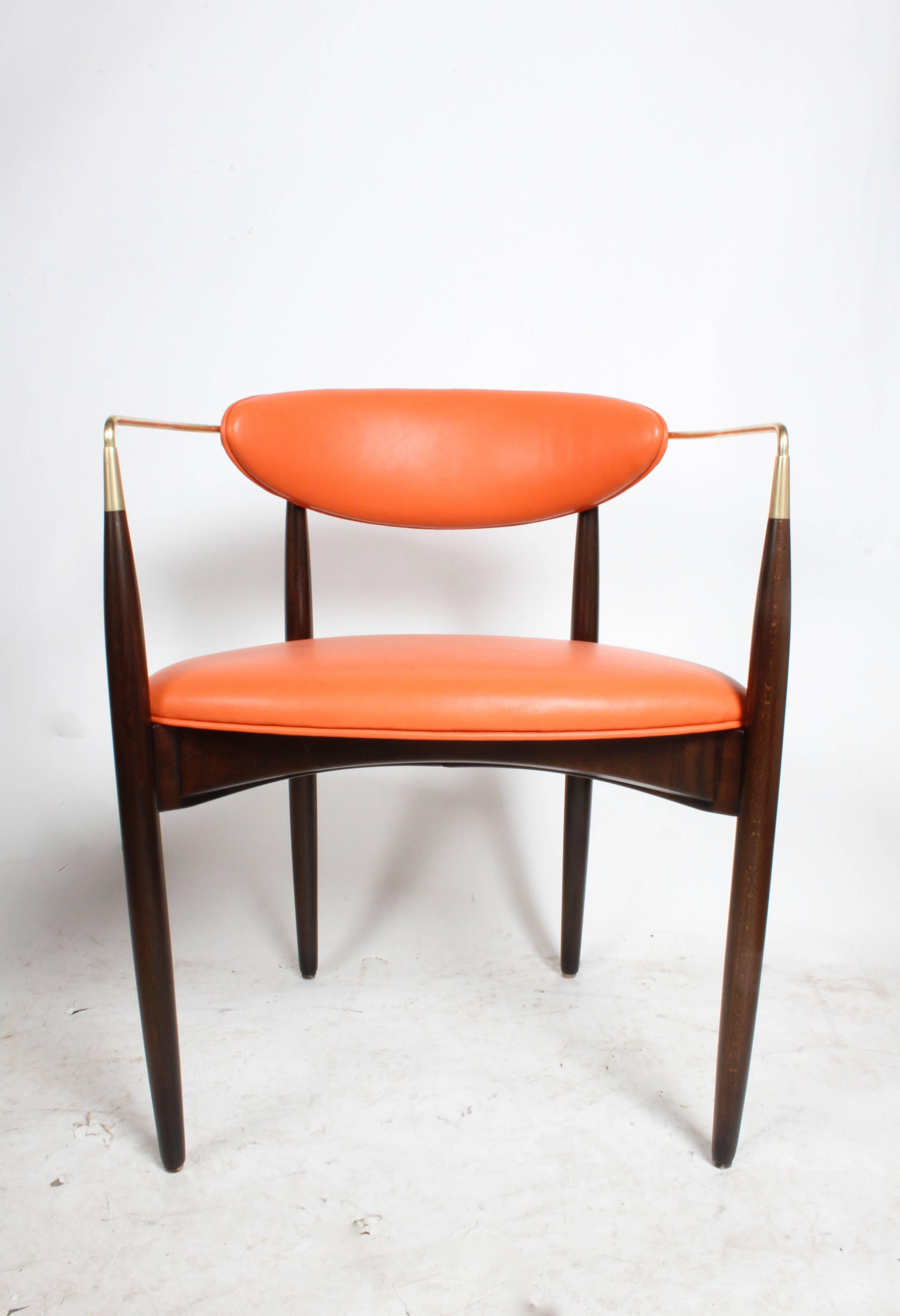 Dan Johnson "Viscount" brass armchairs, circa 1950s. Refinished in dark stain with new foam, orange leather and polished brass. Arm height 26-3/8" COM is available option on these chairs. 