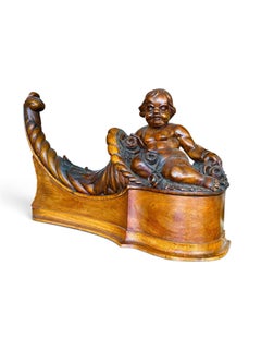 Pair of carved Walnut Cherubs
