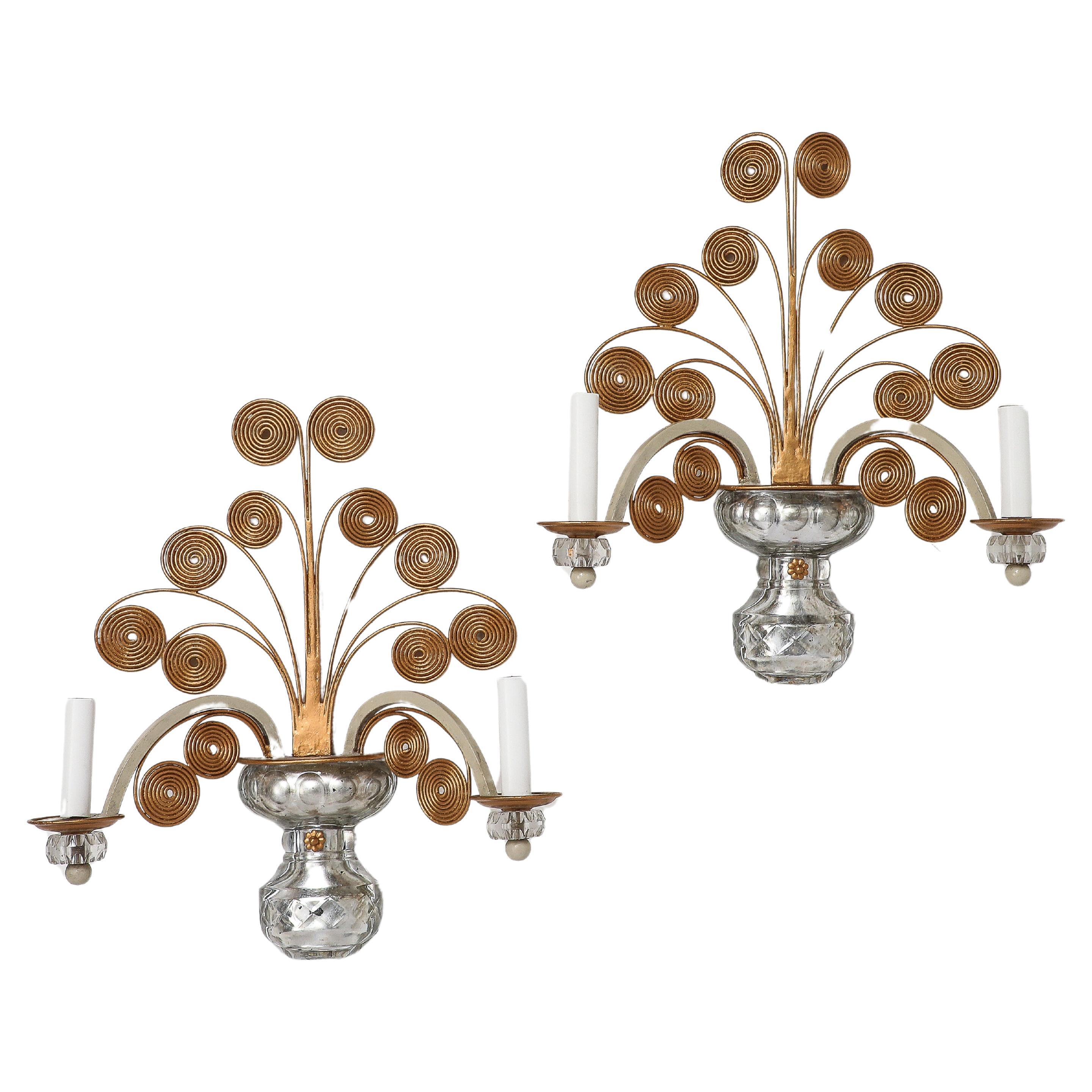 This pair of Banco Firenze Sconces ( one of the sconces has the label on the back) has the esthetics of Bagues sconces. Glass reminded cristal rock and antique finish gold. Each one has 2 lights. The pair has been American wired.