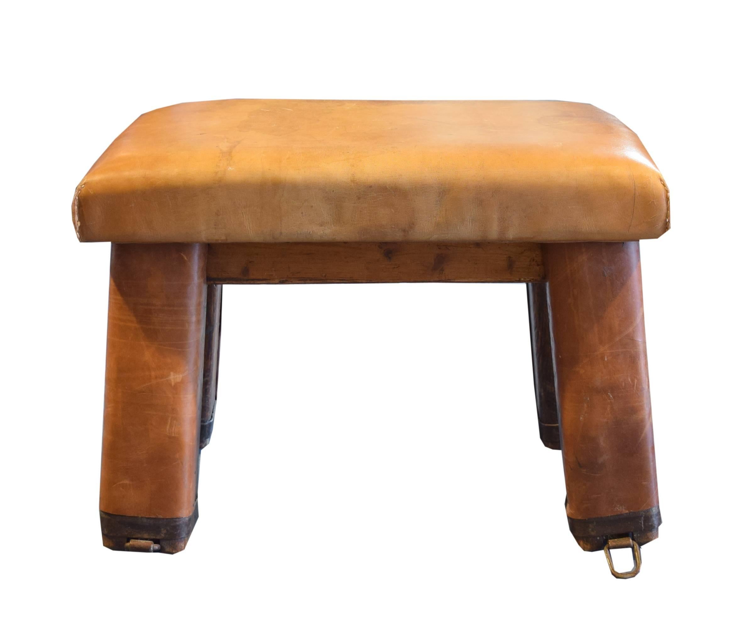 Wooden German vaulting bench with leather wrapped top and legs and wonderful patina, circa 1930.