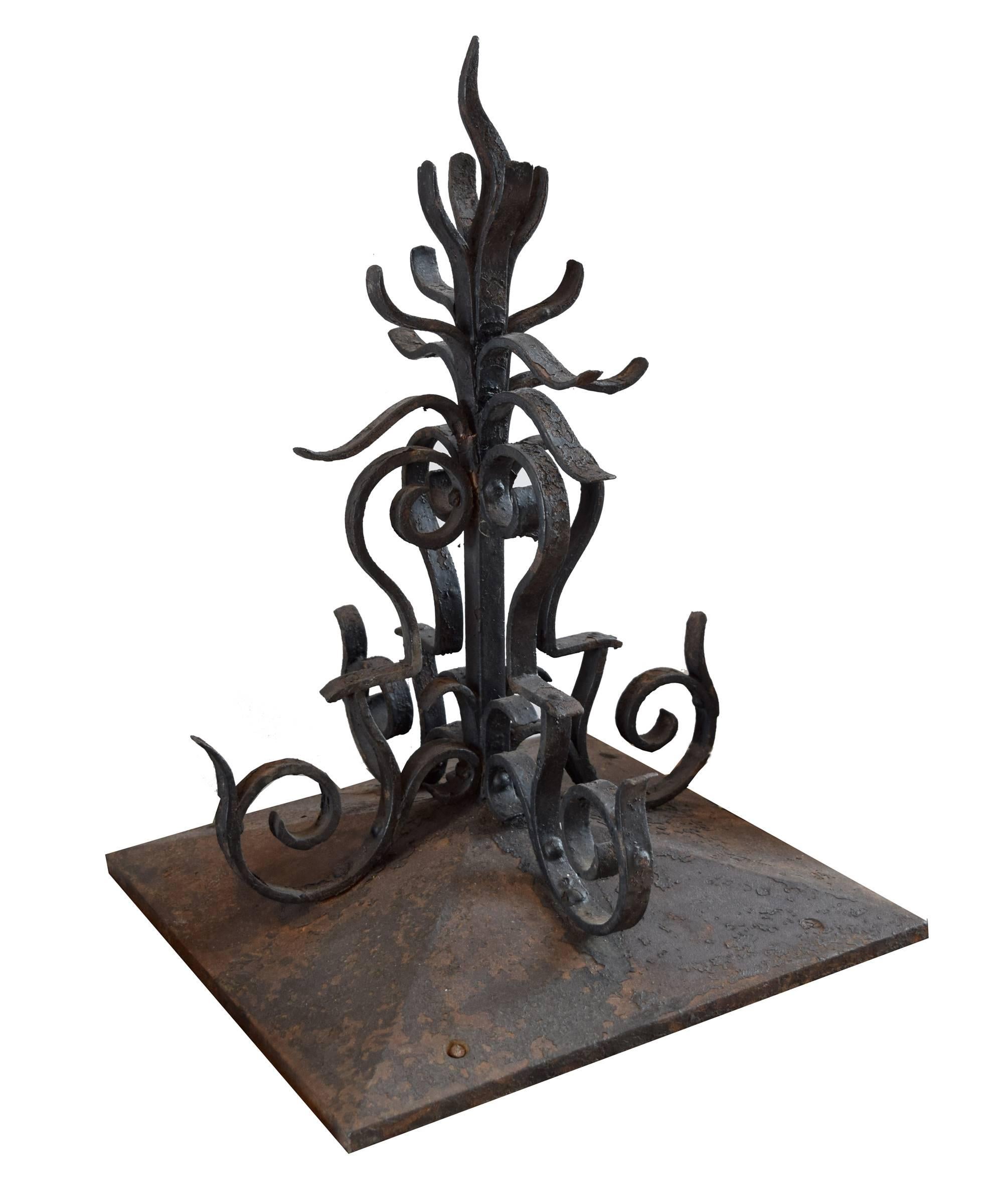 Pair of American wrought iron decorative finials with wonderful scrolling forms on square bases, circa 1880s.