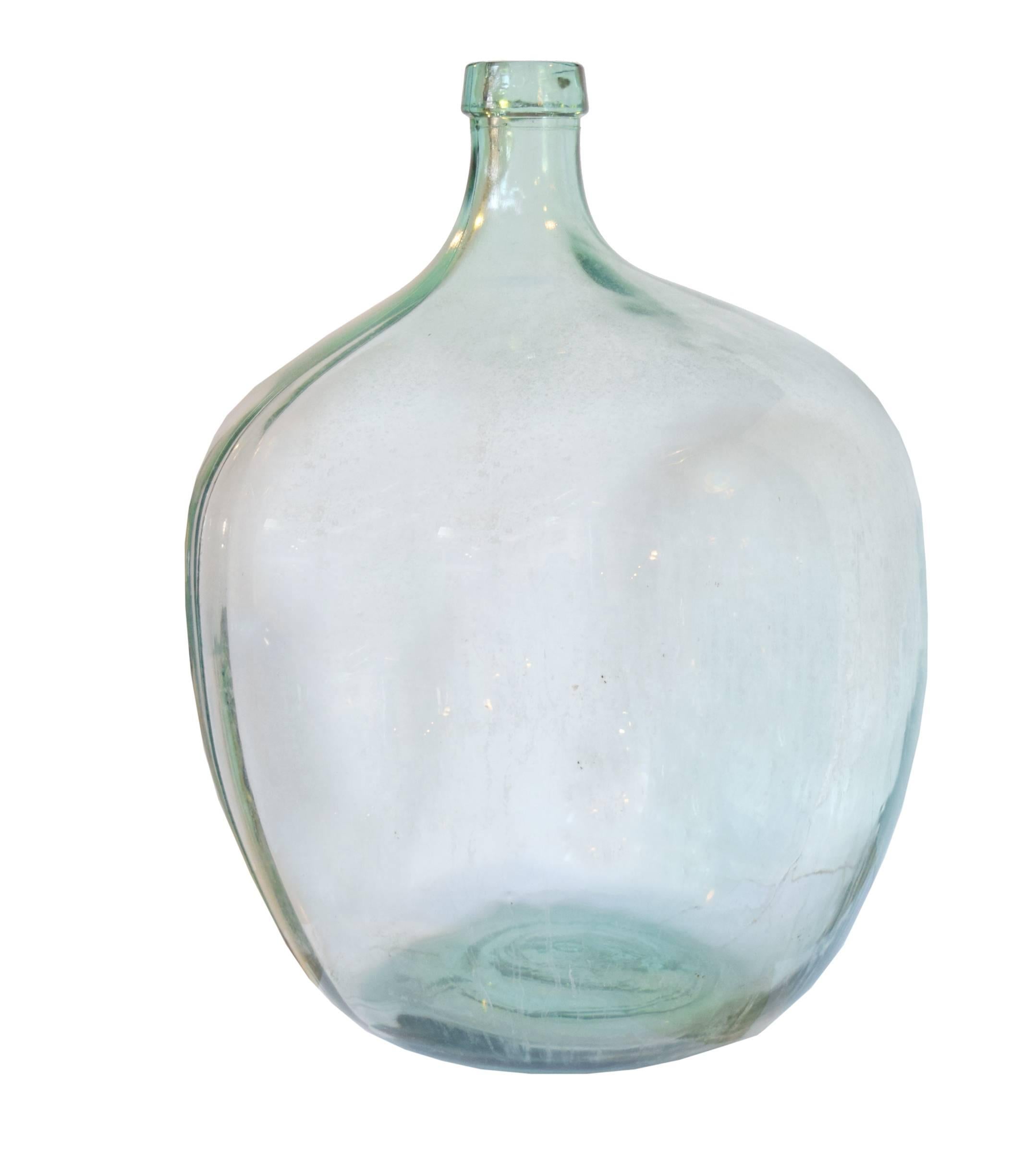 Handblown green glass wine vessel from the Czech Republic, early 20th century. Many available.
Dimensions very slightly, each unique.