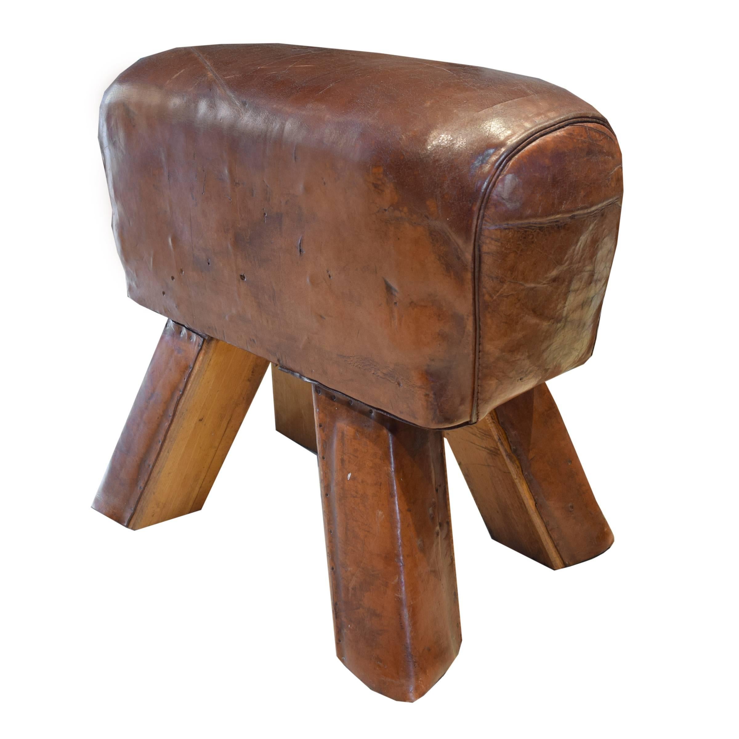 A fantastic early 20th century leather pommel horse bench with leather clad wooden legs, from a gymnasium in the Czech Republic.
