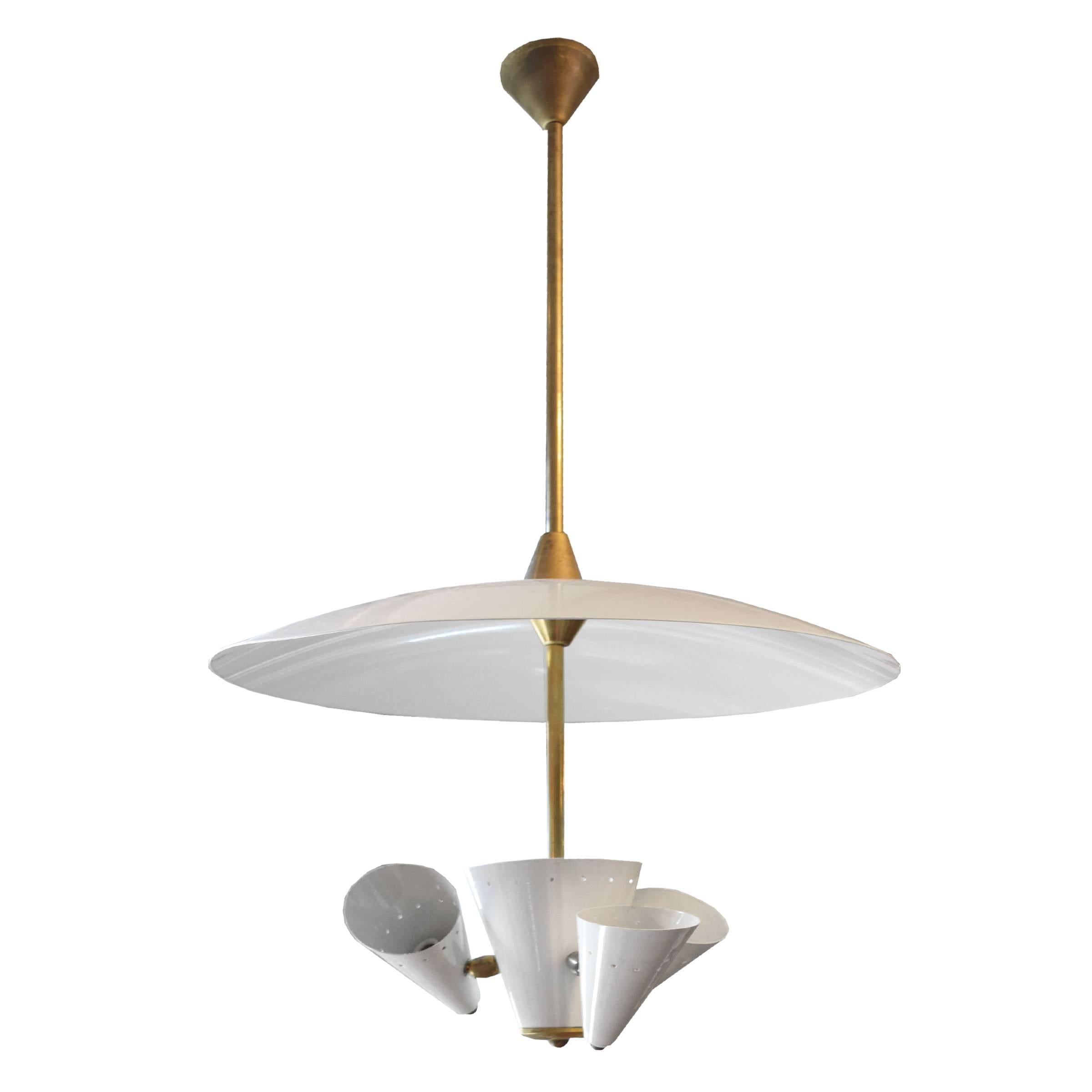 An Italian Mid-Century chandelier with a brass downrod, white enamel dome shade and three pivoting conical shades with perforated detail, Italian three-light chandelier 

Requires rewiring.