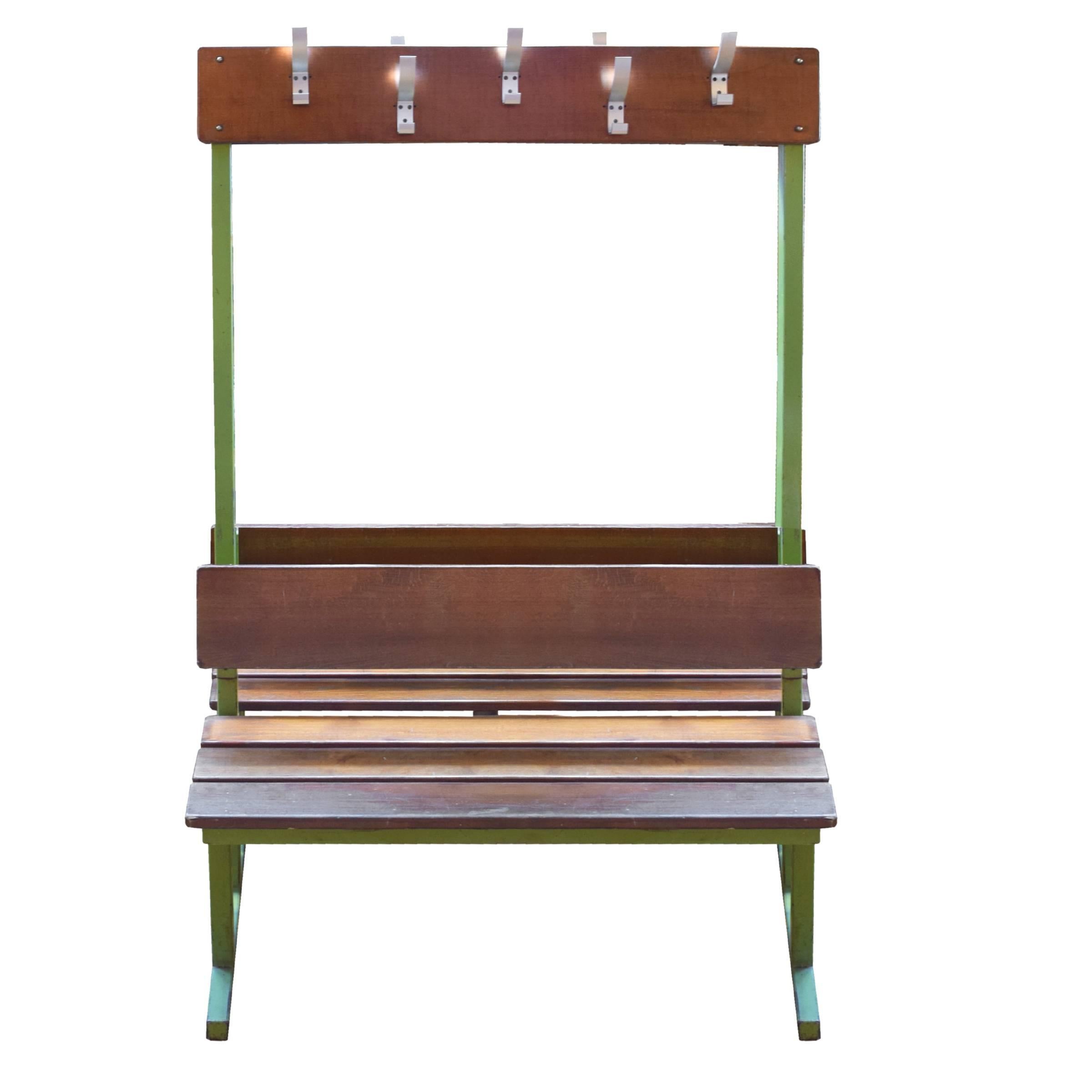 A very cool and useful Mid-Century double-sided French locker room bench with a green metal frame, wood seat and wood coat rack with five metal hooks on each side.
Two available.