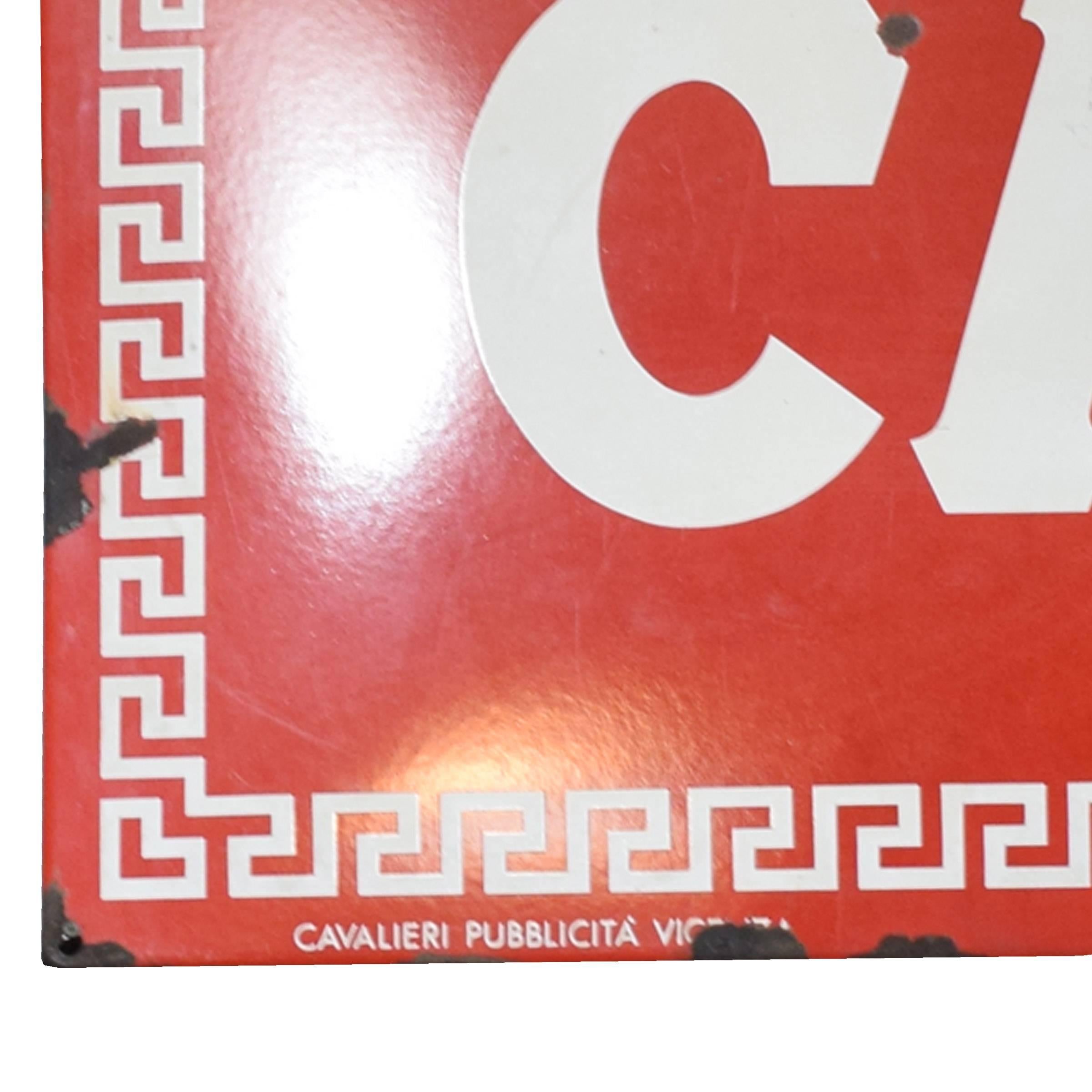 A large Italian enameled metal red and white Campari liqueur advertisement sign manufactured in Vicenza, circa 1950.