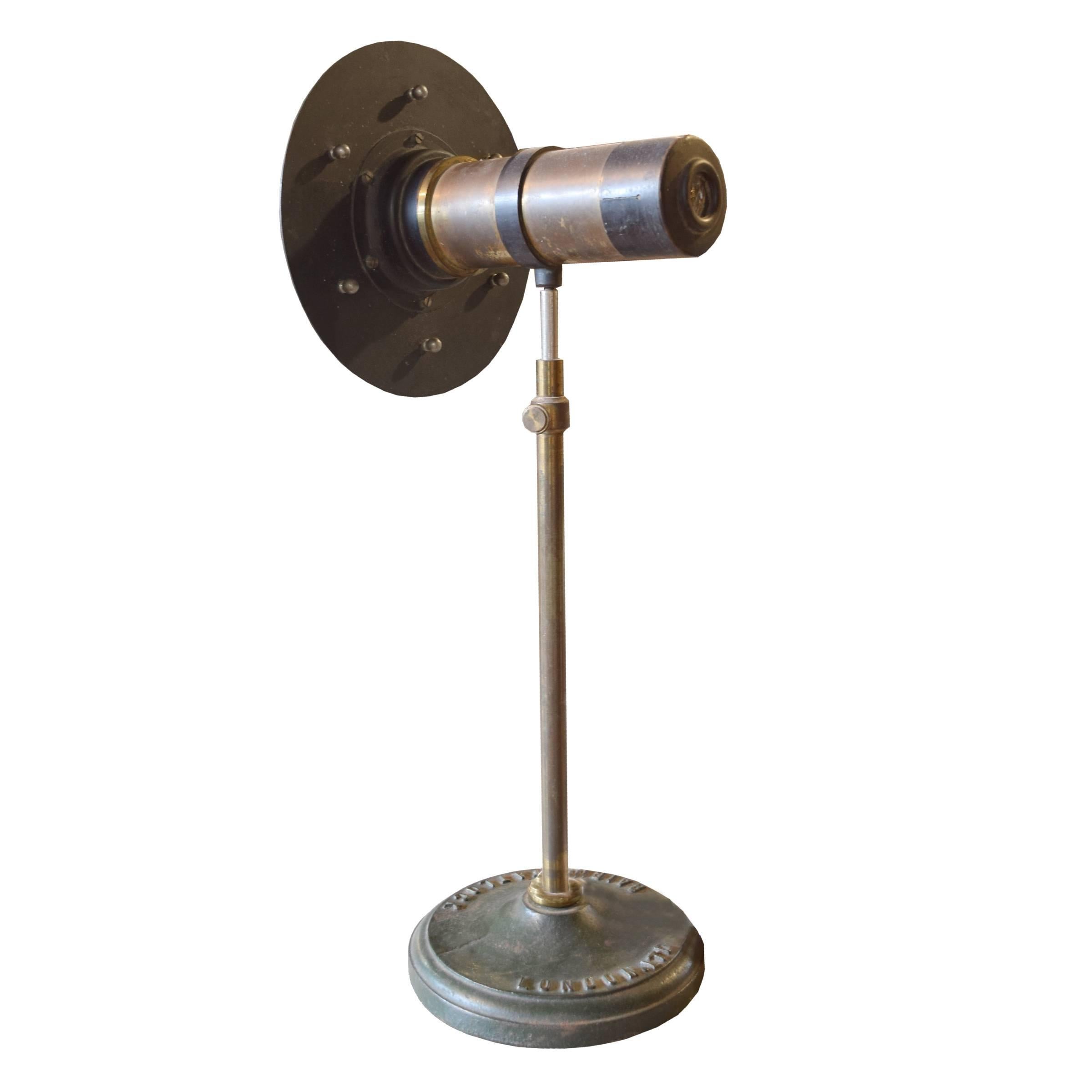 An extremely rare English Victorian kaleidoscope in working condition with a manually rotating front disc and telescoping Stand on a round base. Baird and Tatlock of London specialized in laboratory and scientific instruments starting in the late