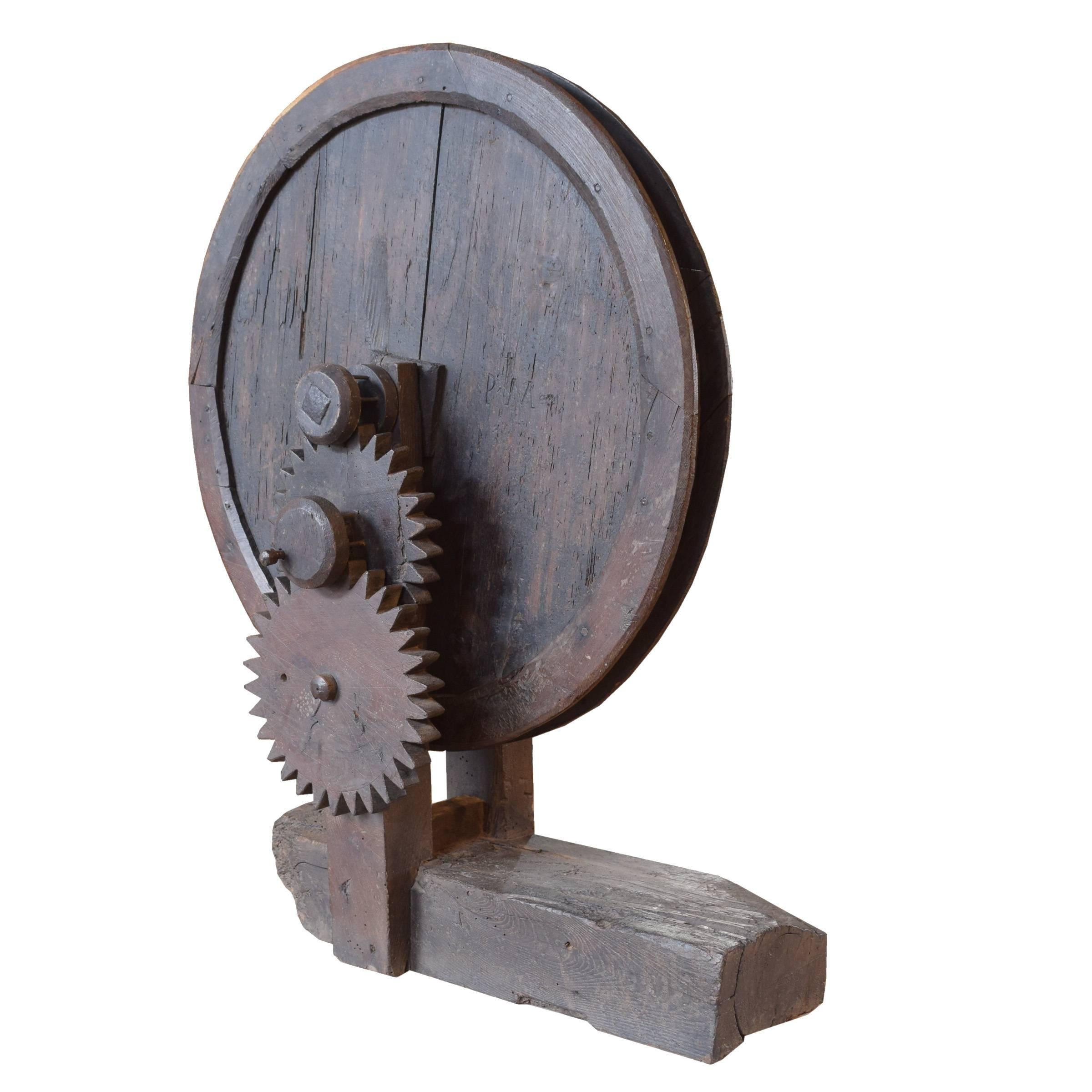 A wonderfully sculptural ancient Italian wood gears and handle from an early clock, circa 16th century.