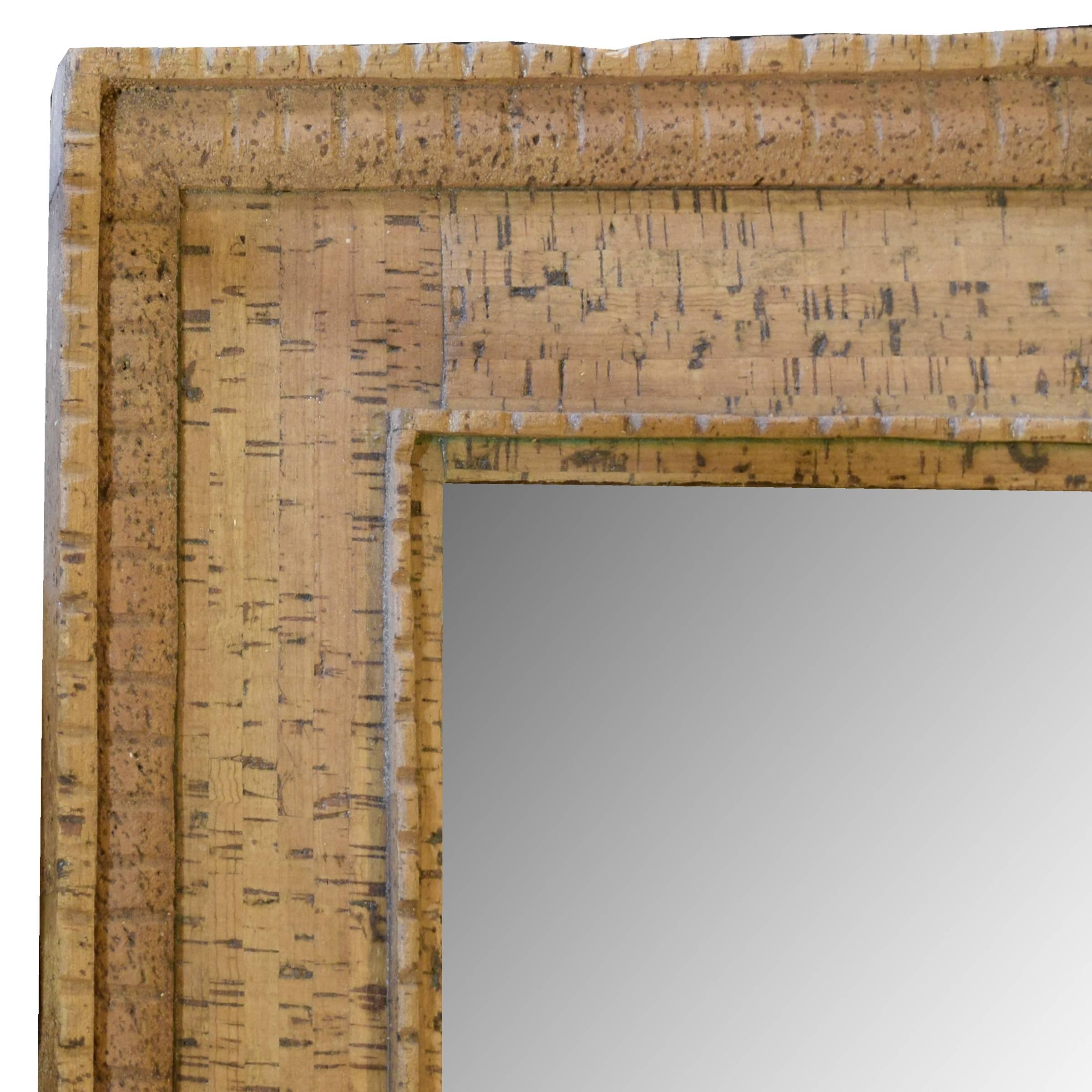 An Italian Mid-Century cork frame with great details and a new mirror.