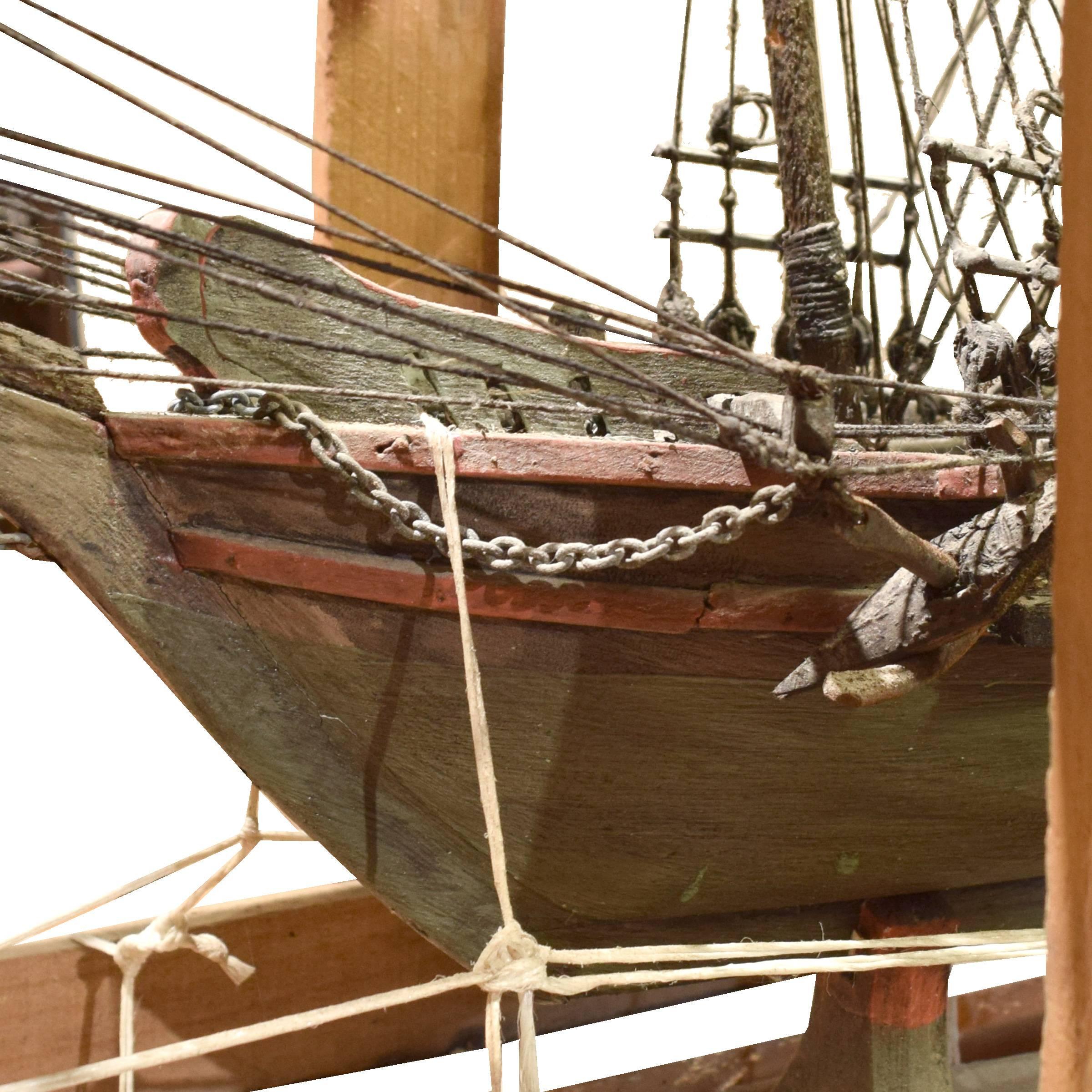 A beautifully crafted and highly detailed French handmade model ship in its original crate.