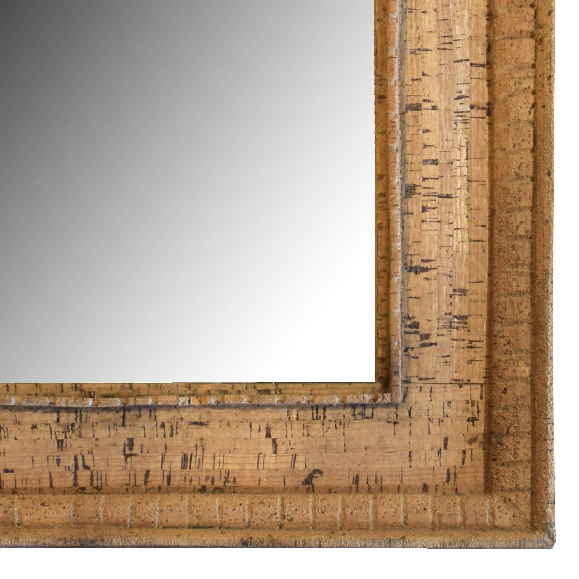 An Italian Mid-Century cork frame with great details and a new mirror.