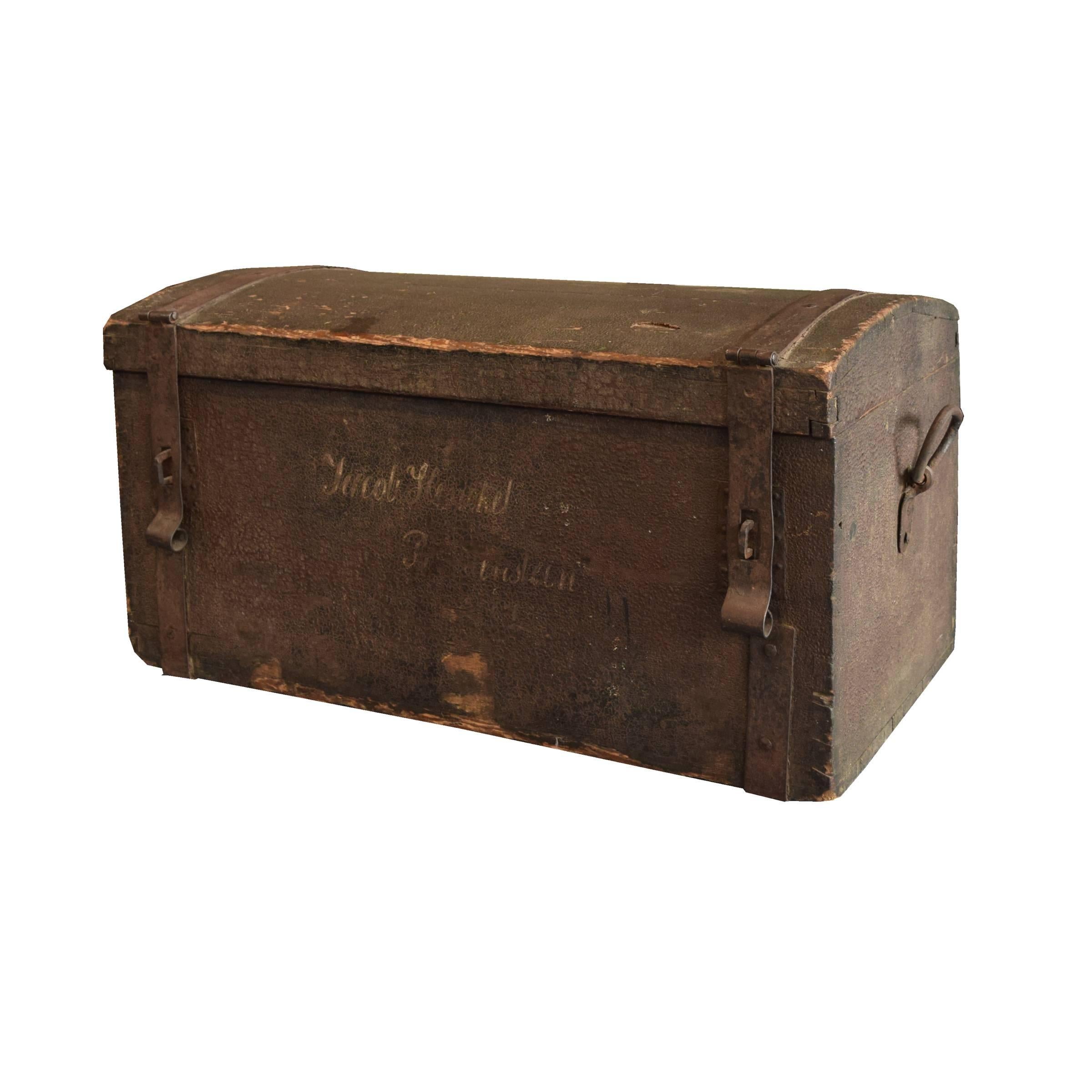 A European wood trunk with a beautiful patina and great iron straps and handles, circa 1900.