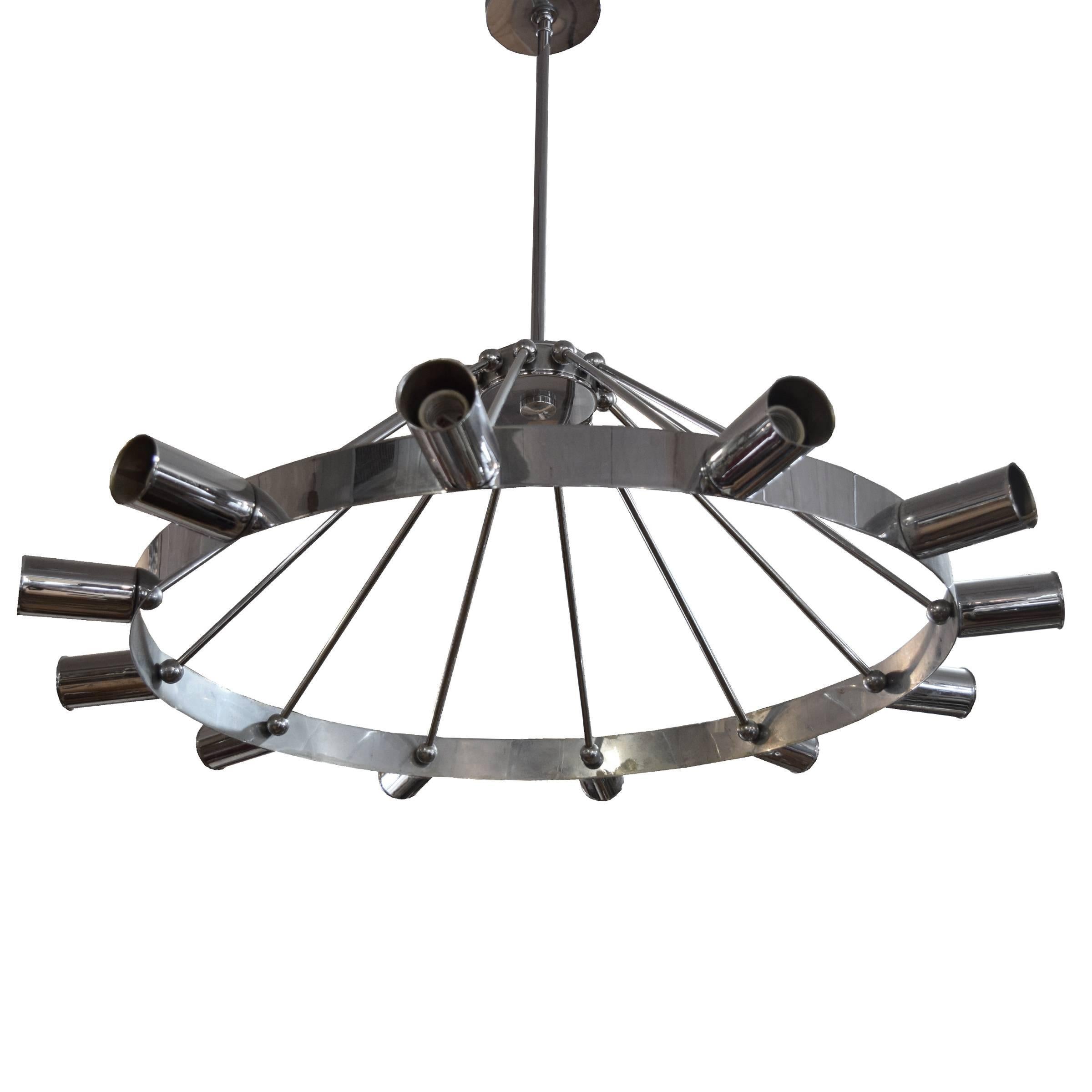 An American Mid-Century chrome chandelier with 12 lights around a ring connecting to a center hub.
Requires re-wiring.