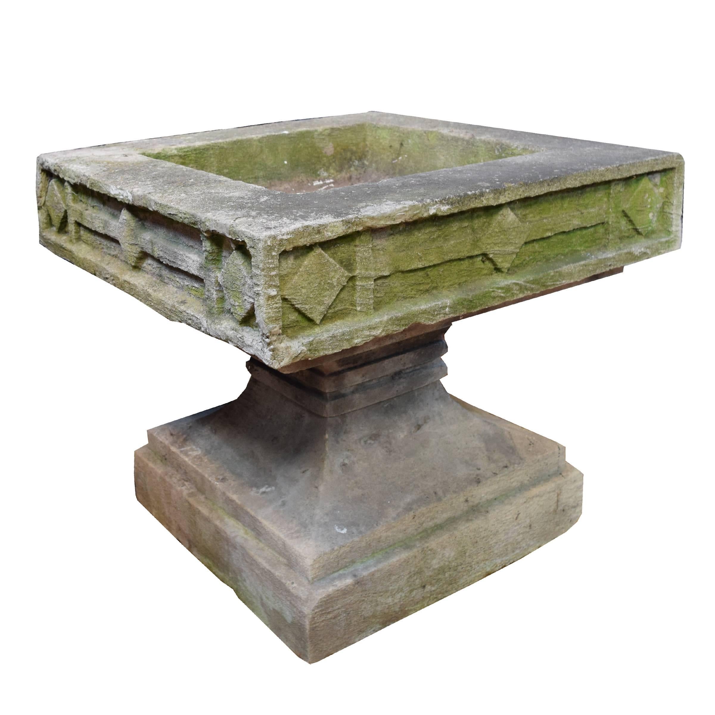 An American carved limestone Prairie School planter with a great moss covered surface.