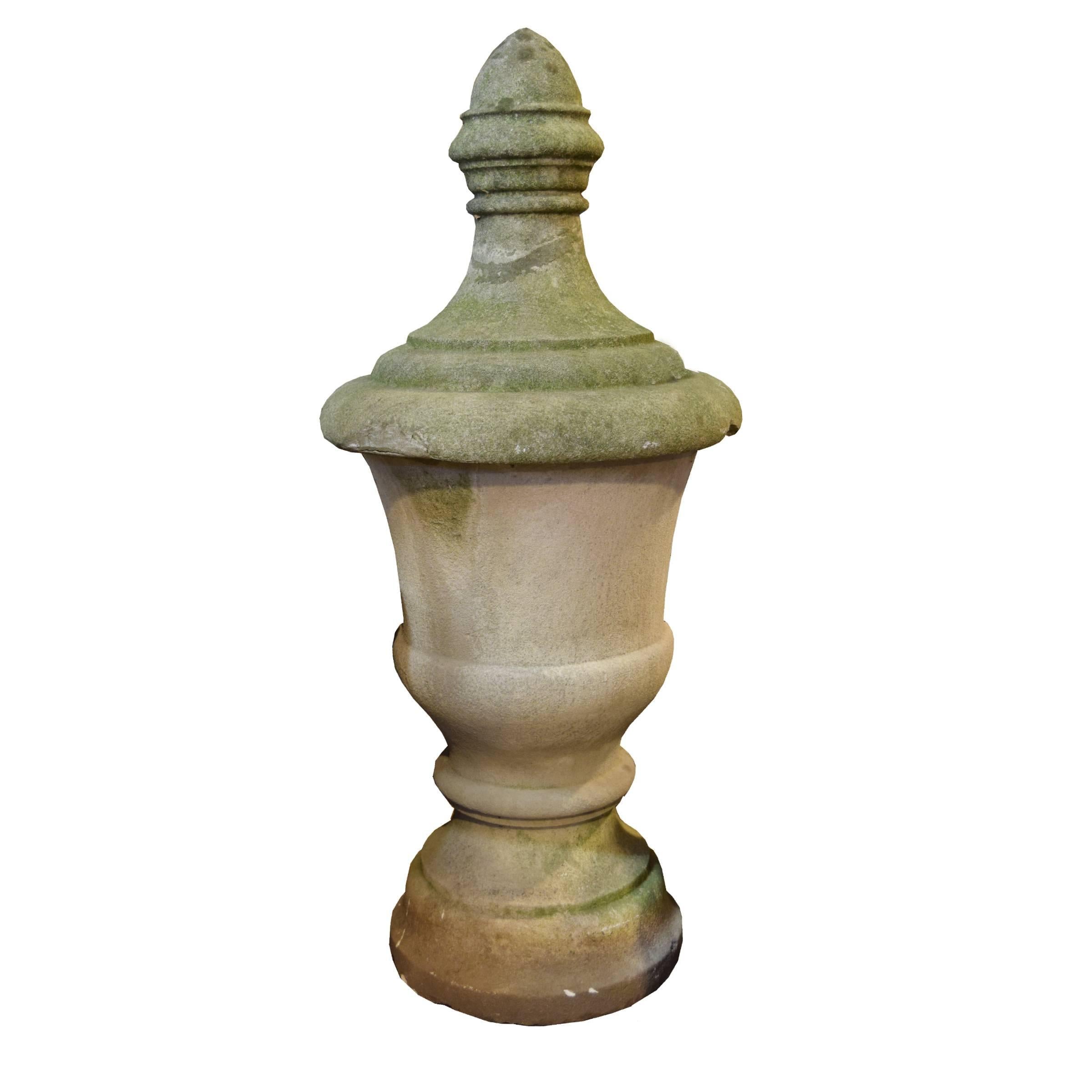 A pair of American carved limestone building finials with a great mossy patina.