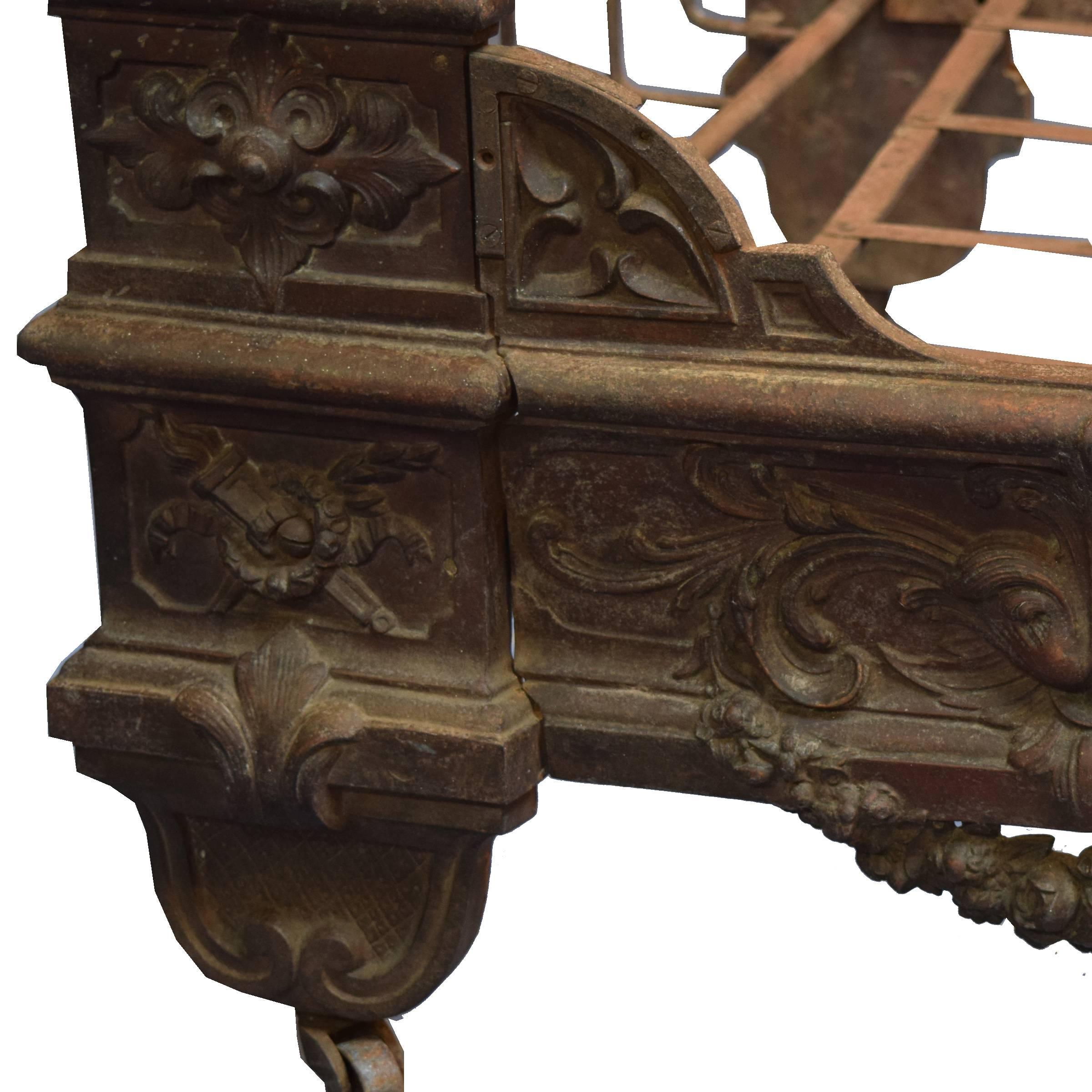 A very nice French cast iron fold up daybed with wonderfully cast cherub figures and floral swag details, 19th century.