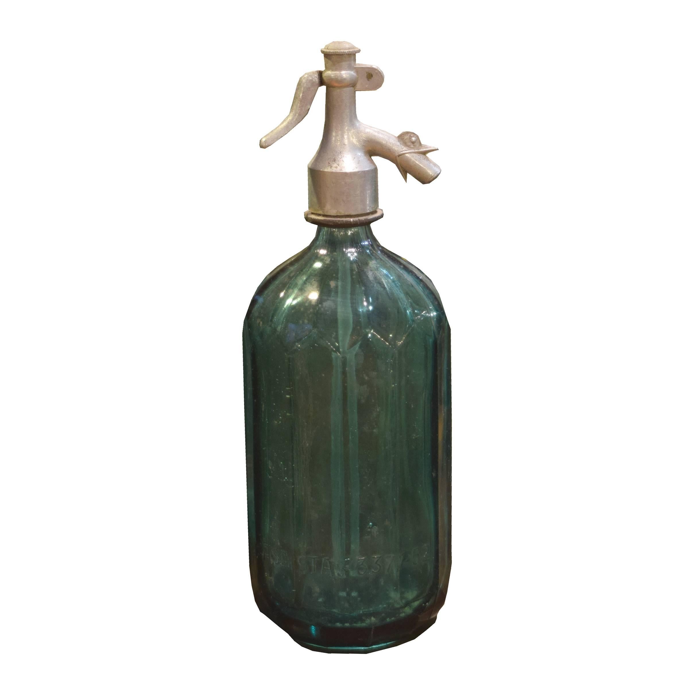 A very cool Italian faceted green glass seltzer bottle with a rooster head spout. Many available.