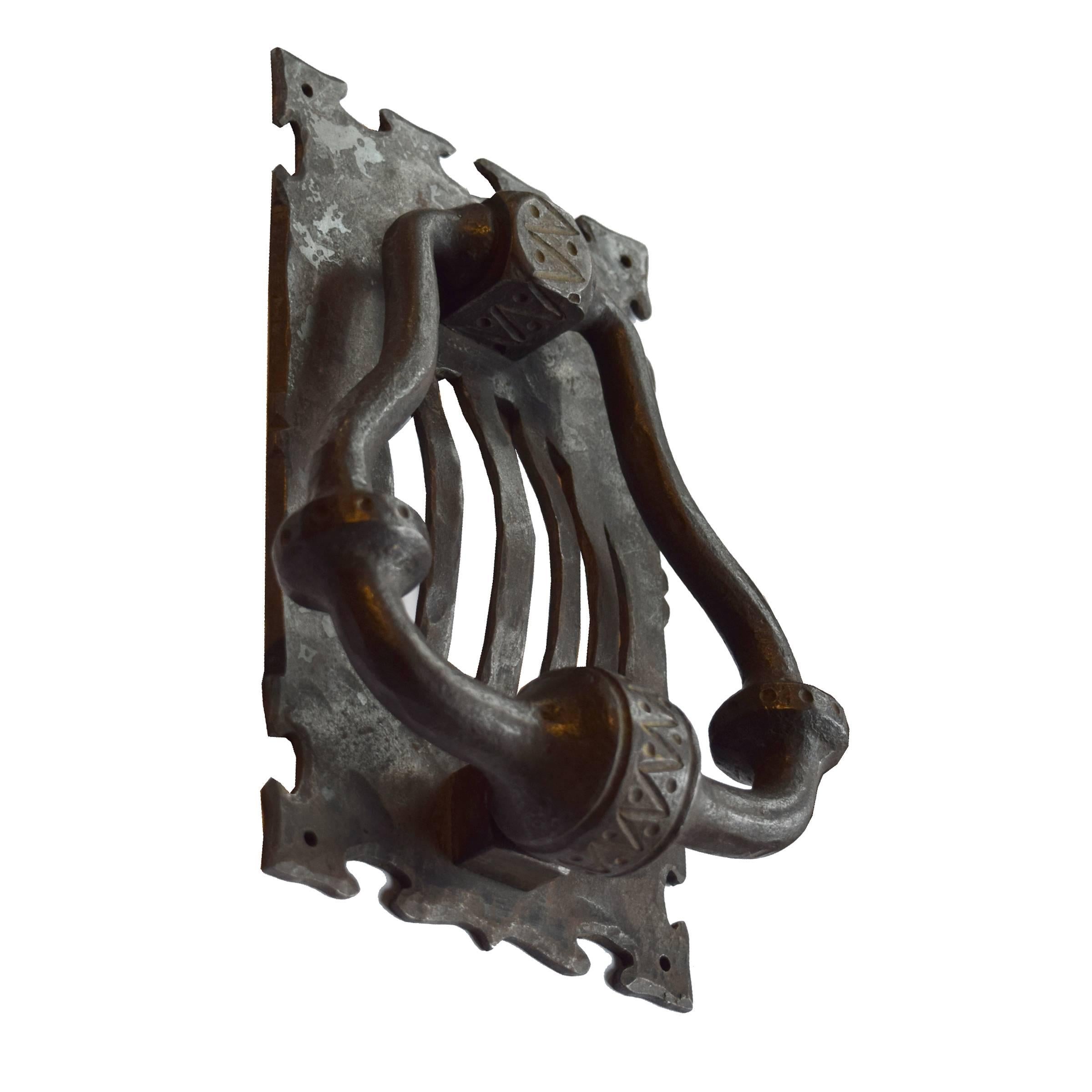A wrought iron door knocker from the Argentine estate of world renowned blacksmith Jose Thenee. Thenee is considered one of the world's greatest blacksmiths and won the world title in 1923.