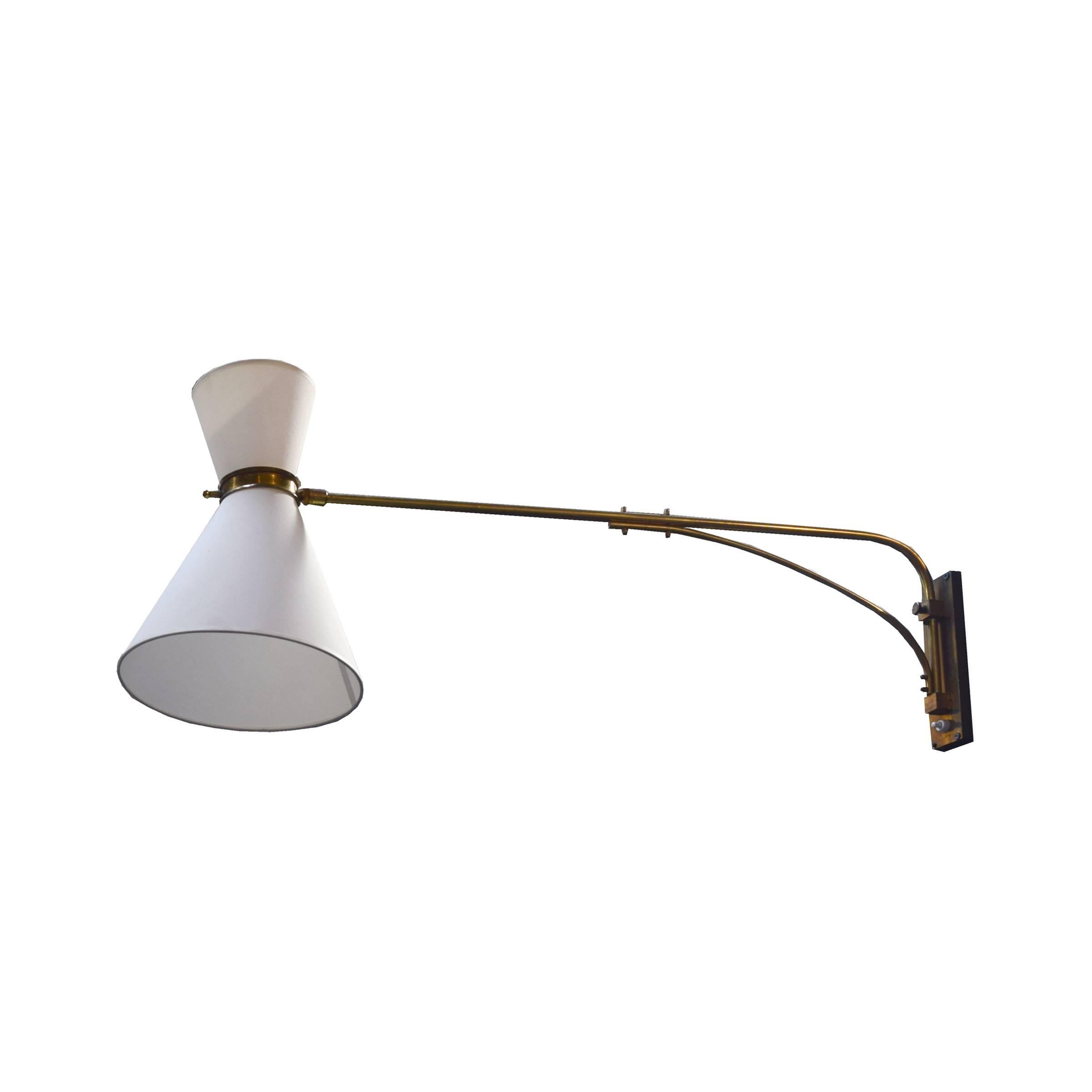 An Italian swing arm wall sconce with telescoping arm and new fabric shades. In the style of Stilnovo.