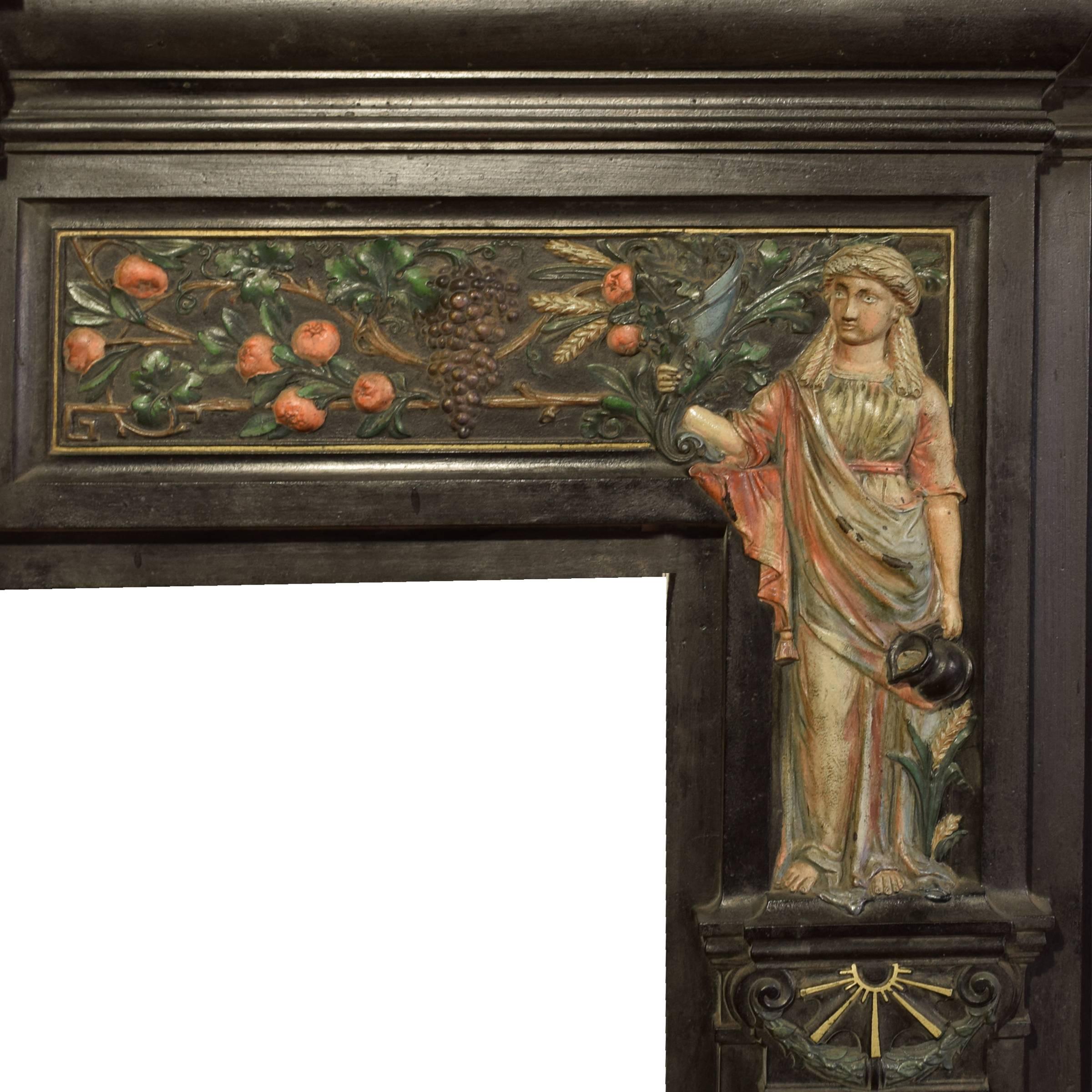 An English polished cast iron fireplace mantel painted to highlight the 'peace and plenty' motif, circa 1880.
Firebox dimensions: 35.75