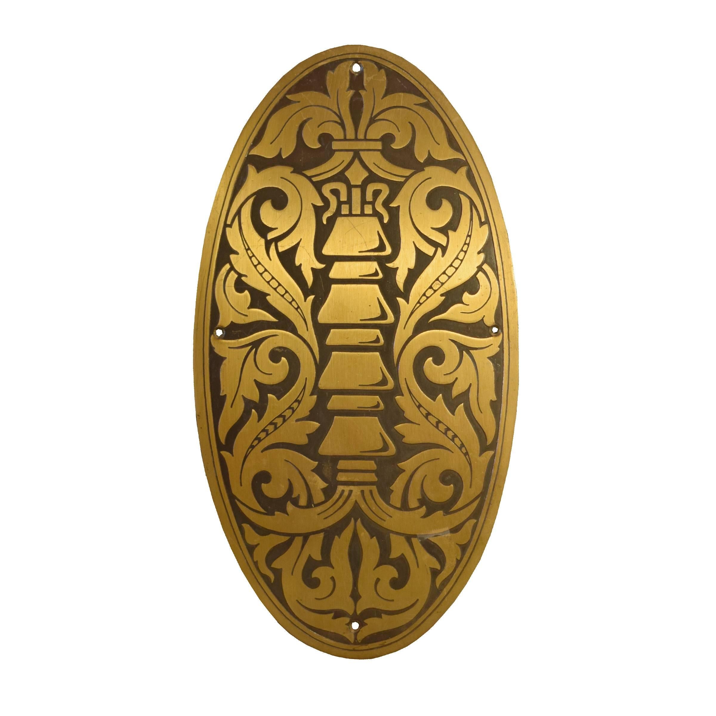 Pair of American decorative brass elevator door plates with an acanthus leaf motif, circa 1920.