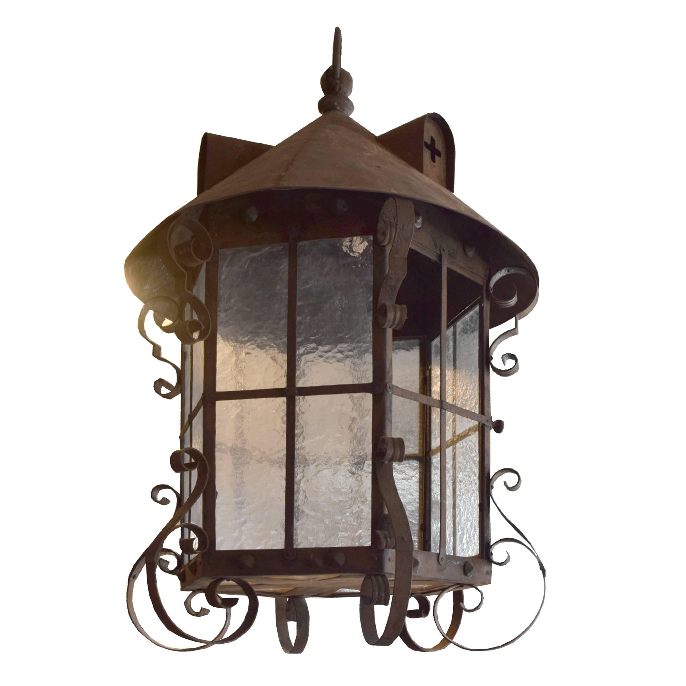 A six-sided wrought iron lantern with hammered glass shades from the Argentine estate of José Thenee. Thenee is considered one of the greatest blacksmiths and won a world title in 1923.
 