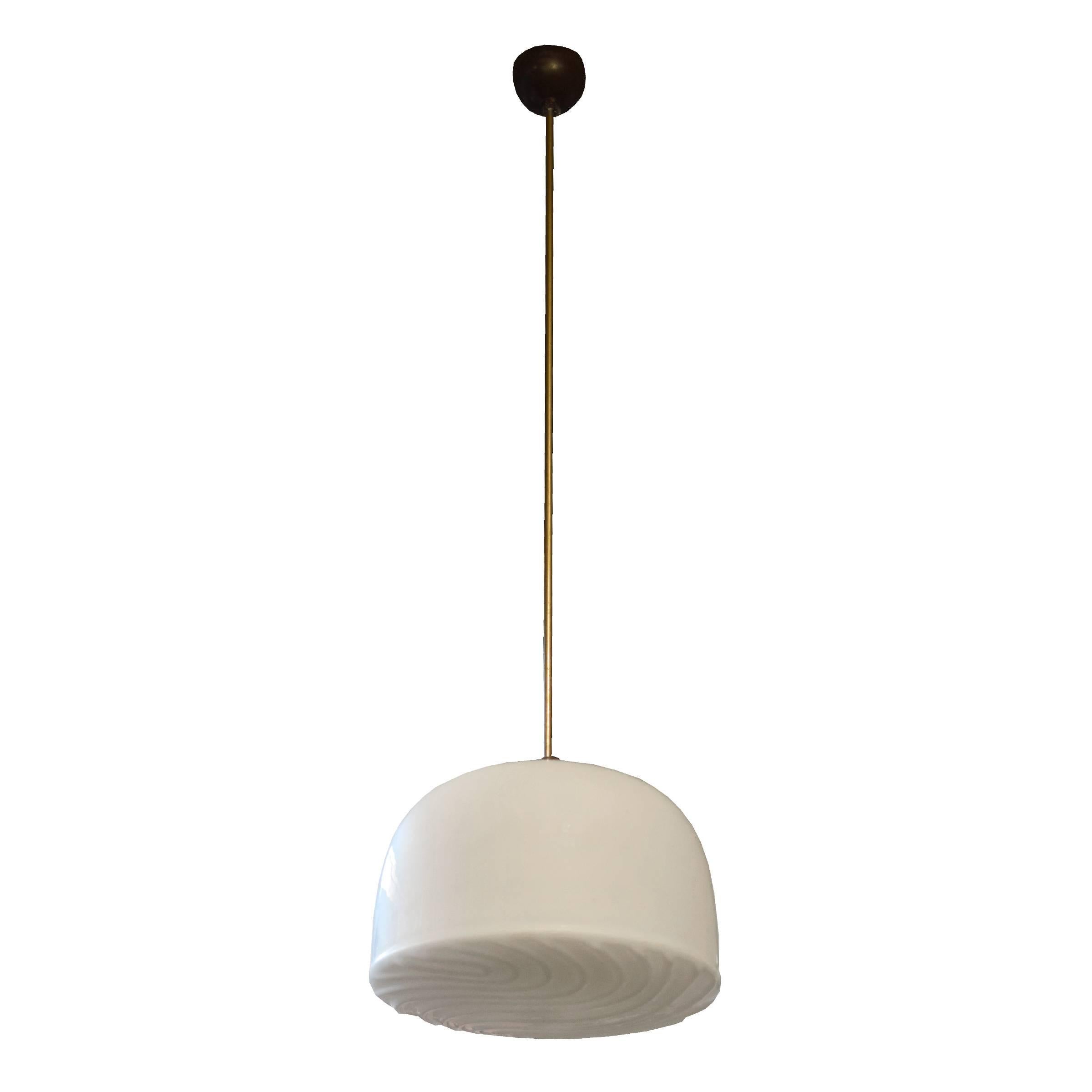 A Czech republic Mid-Century pendant light fixture with an opaque glass shade with a raised design. Four available.