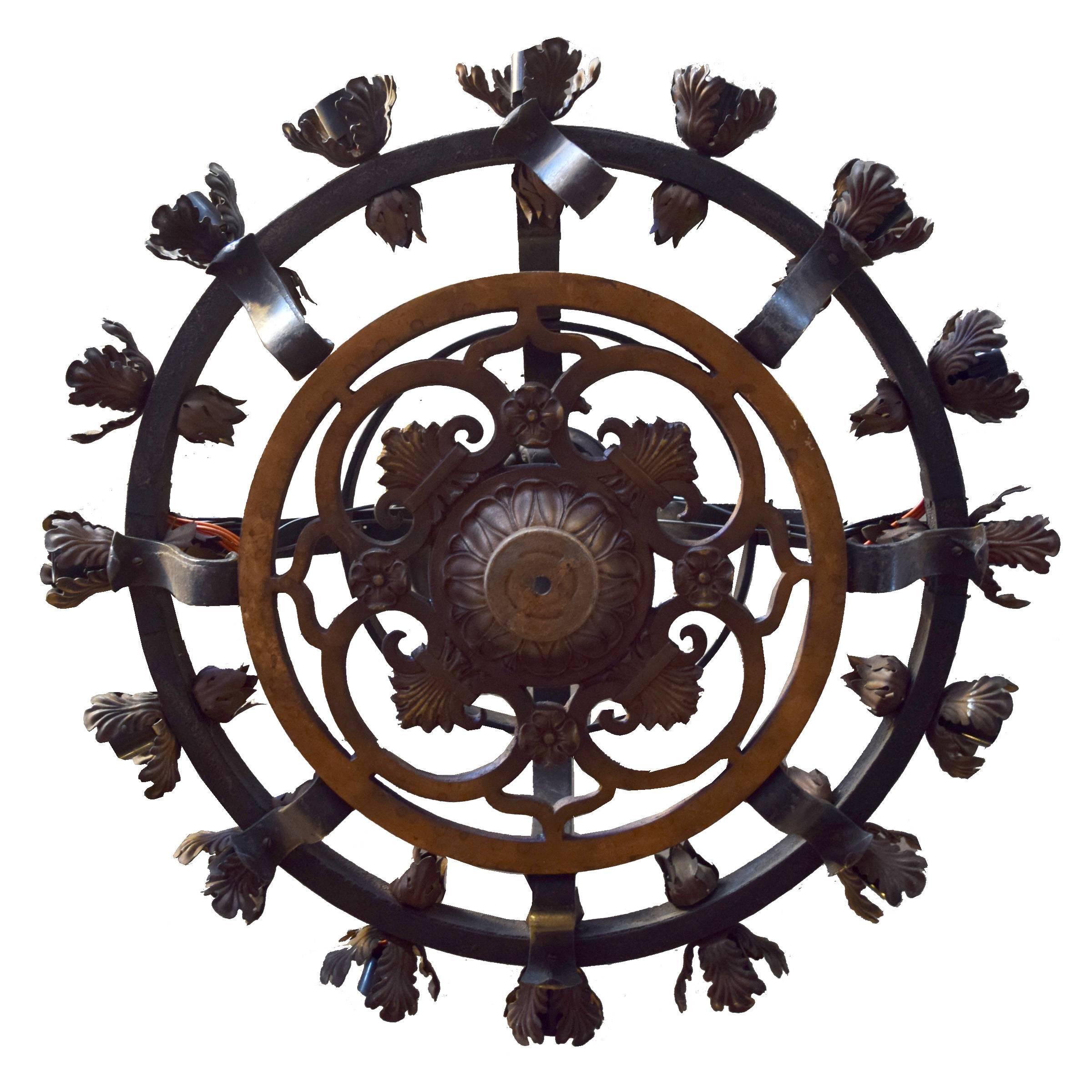 A great quality iron chandelier with sixteen lights with an acanthus leaf motif, circa 1900. Many available.
  