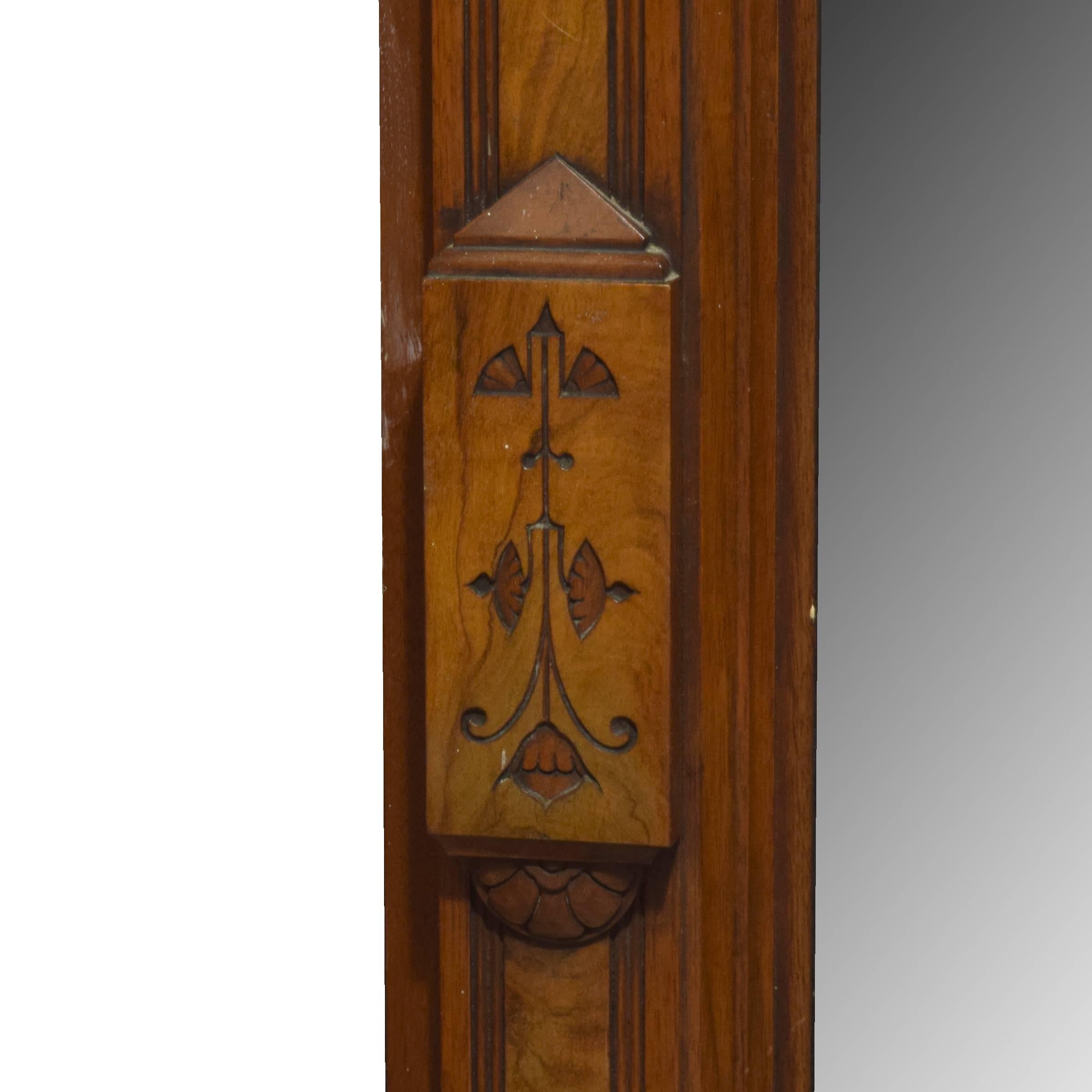 A fantastic American walnut pier mirror with great details and carvings along the sides and top.