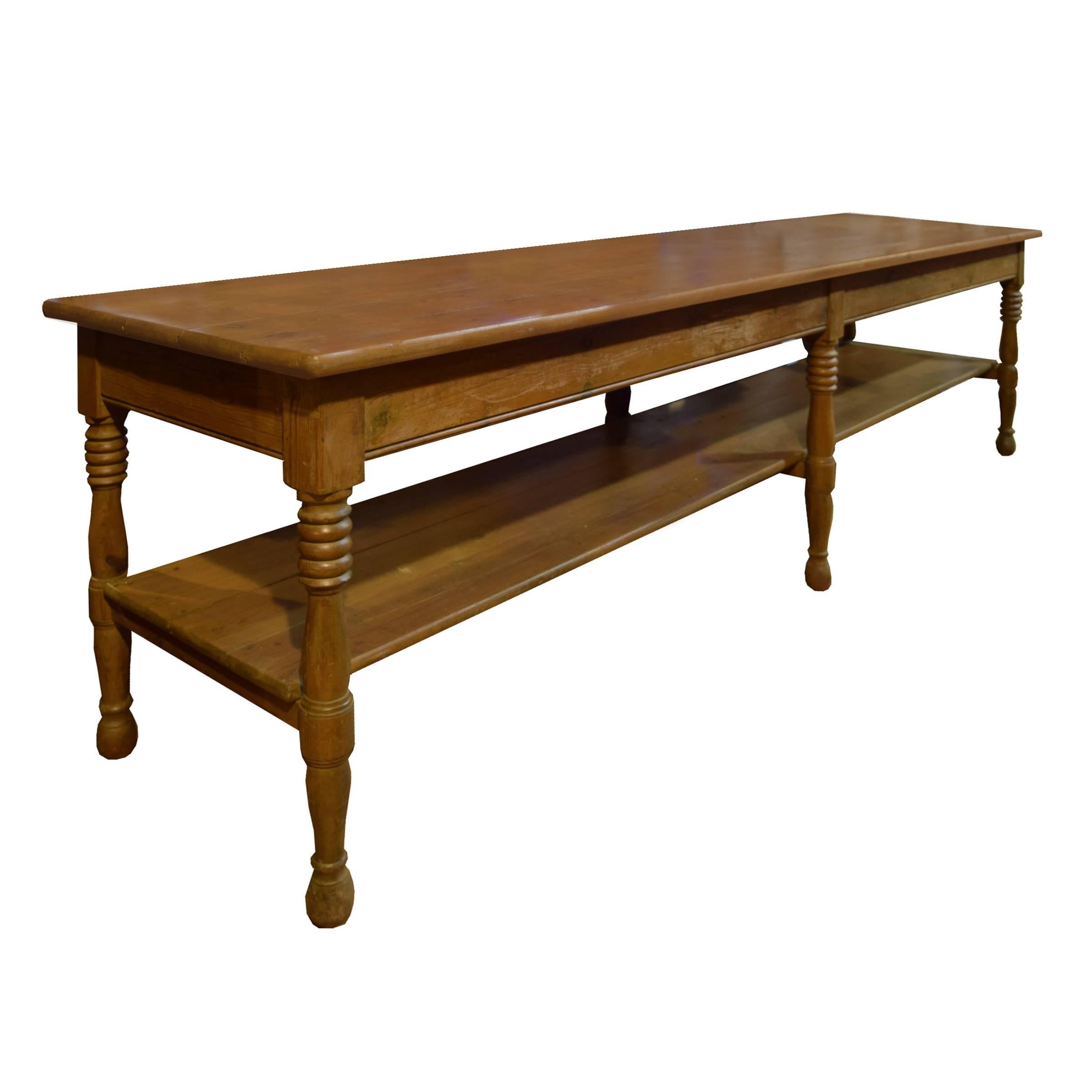 A beautiful French oak draper's table with one drawer, a lower shelf, and six wonderfully turned legs, circa 1900.
