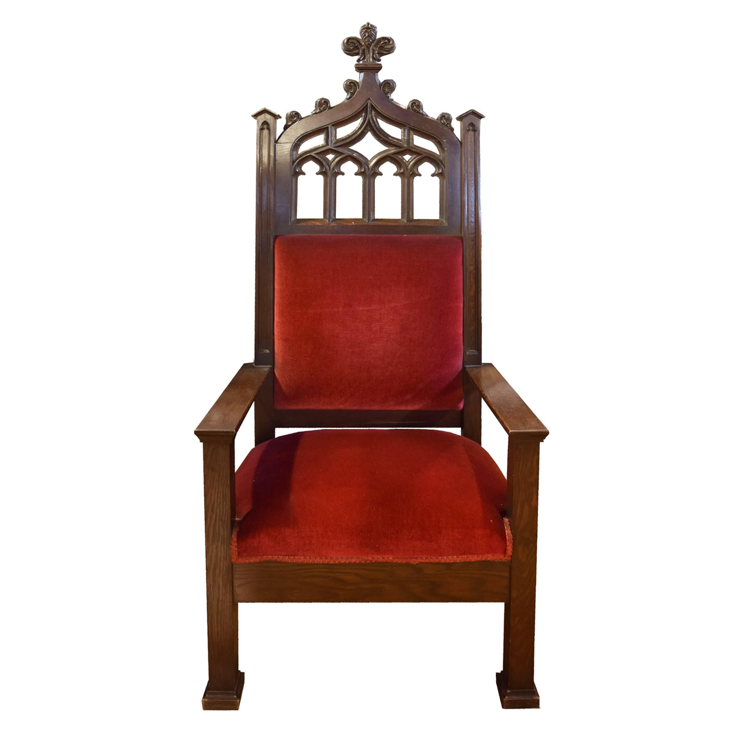 An impressive pair of American throne chairs with wood frames, highly carved backs and plush red upholstery, circa 1910.
  