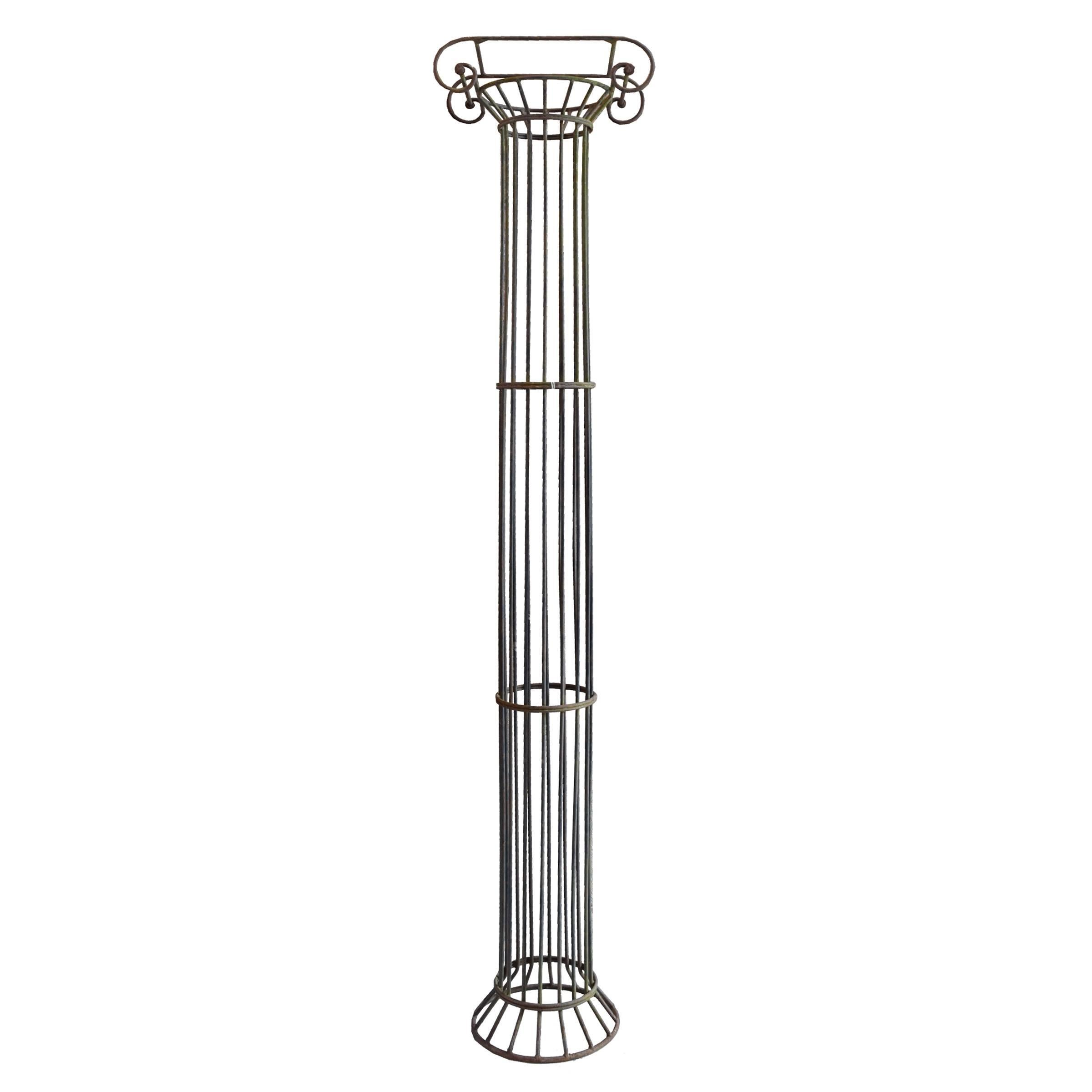 A pair of French Mid-Century wrought iron Ionic columns with a Classic design. Great indoors or out.