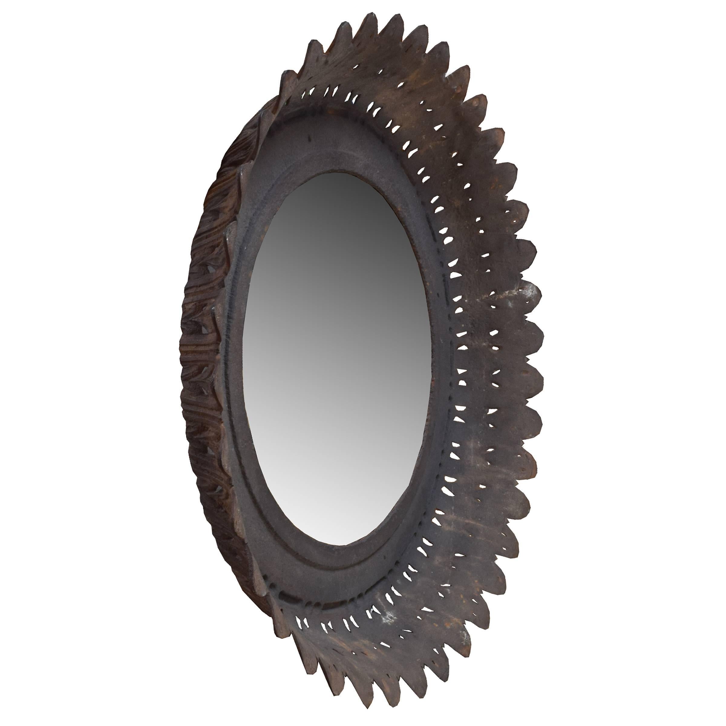 A French cast iron fountain fragment with a leaf design, circa 1880, with a mounted mirror.