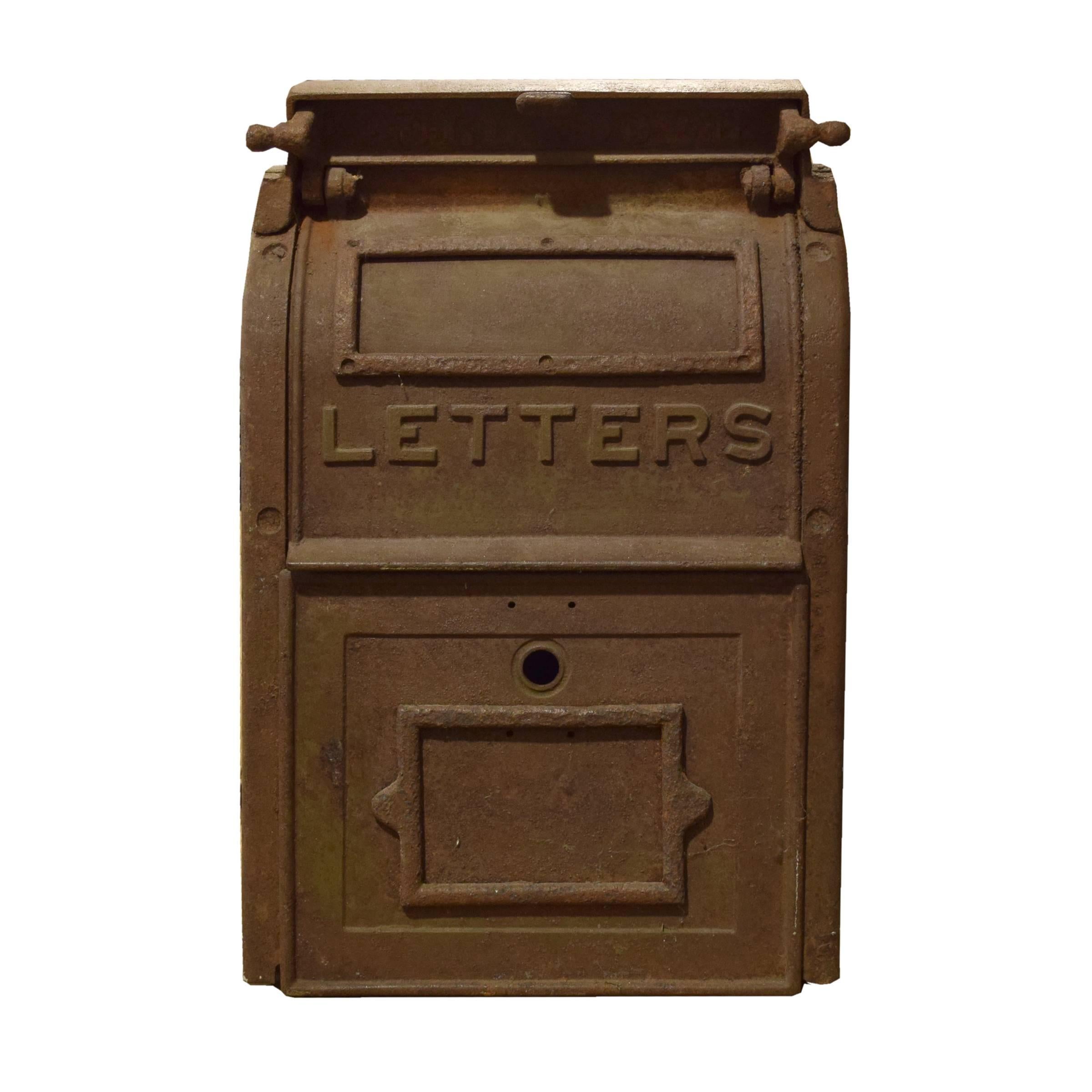 A cast iron U.S. mailbox manufactured by the Hebert Manufacturing Company, Franklin, NH, circa 1930, with functioning mail slot and retrieval door.